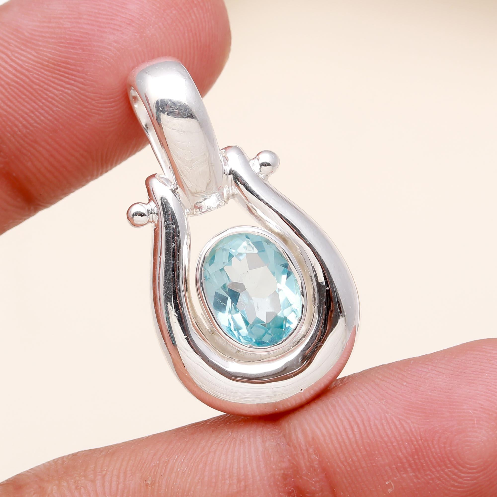The Azure Loop: Blue Topaz Modern Silver Pendant