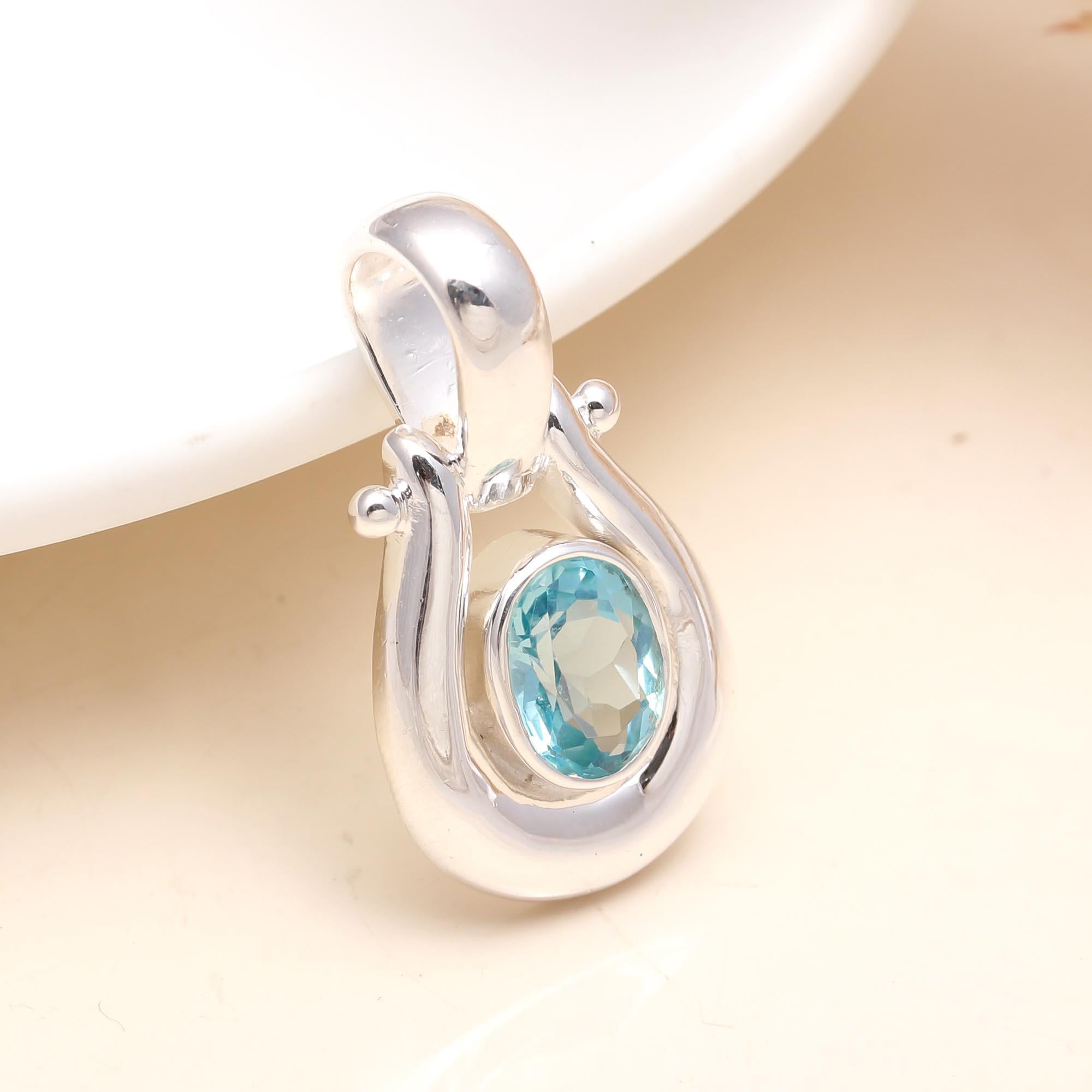 The Azure Loop: Blue Topaz Modern Silver Pendant