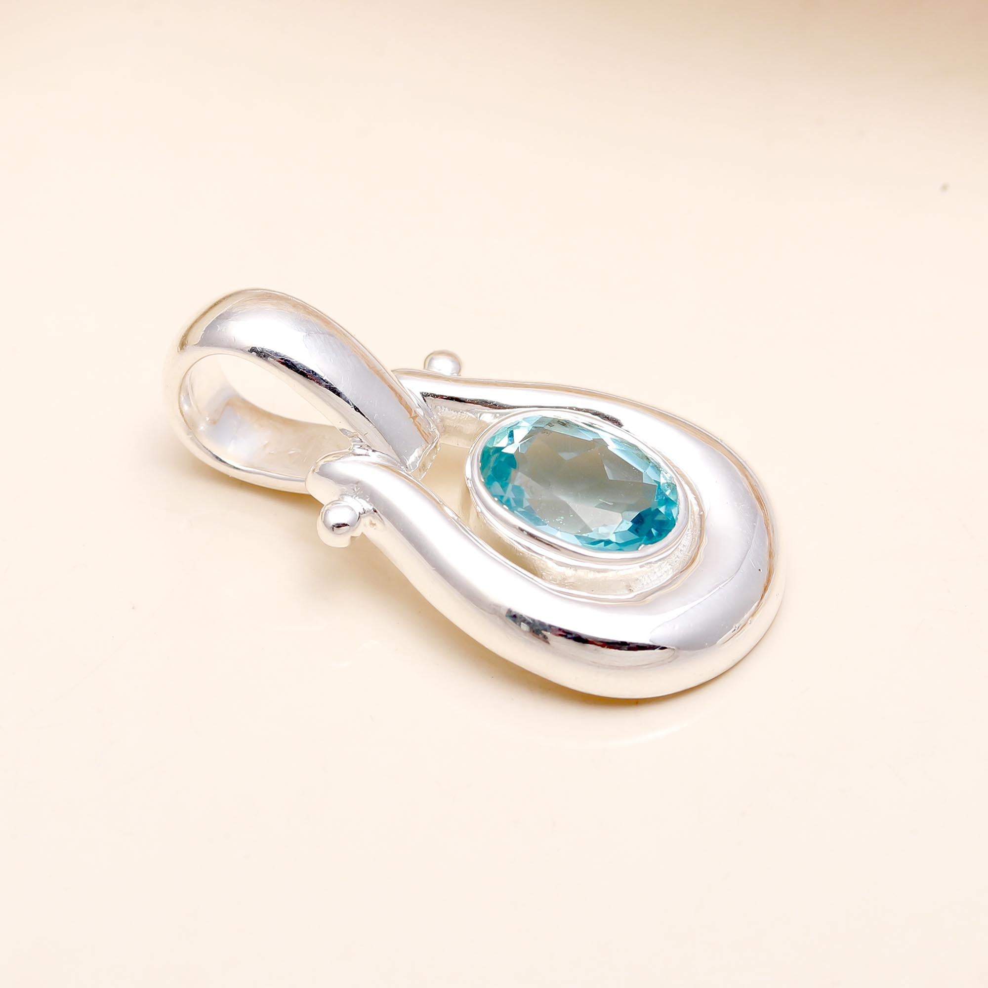 The Azure Loop: Blue Topaz Modern Silver Pendant