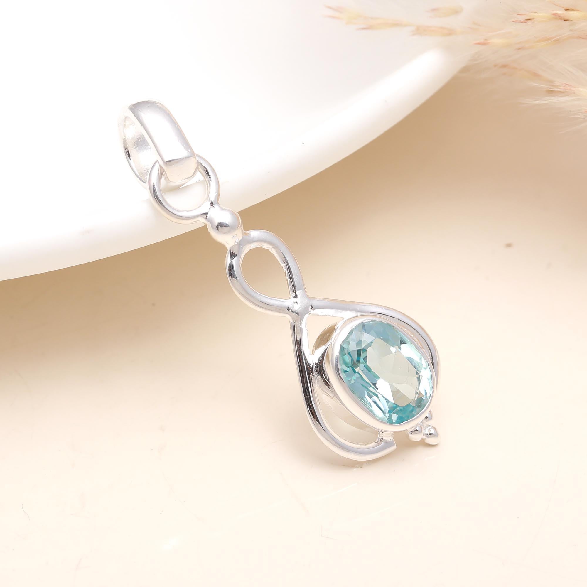 The Azure Infinity: Blue Topaz Elegant Loop Pendant