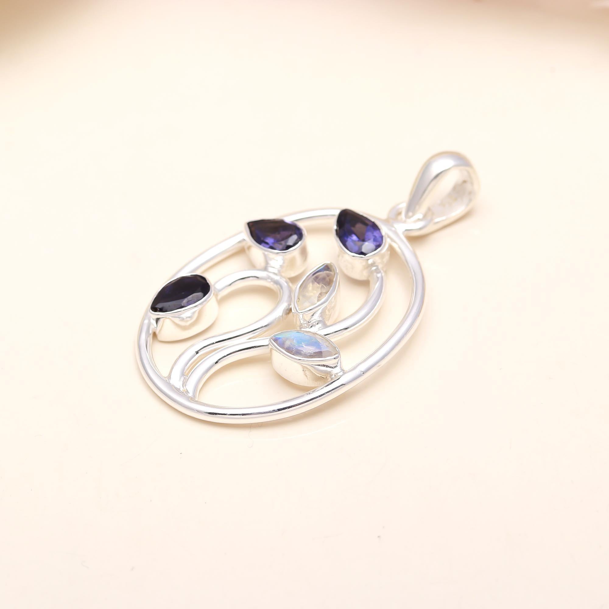 Silver Pendant Studded With Faceted Iolite