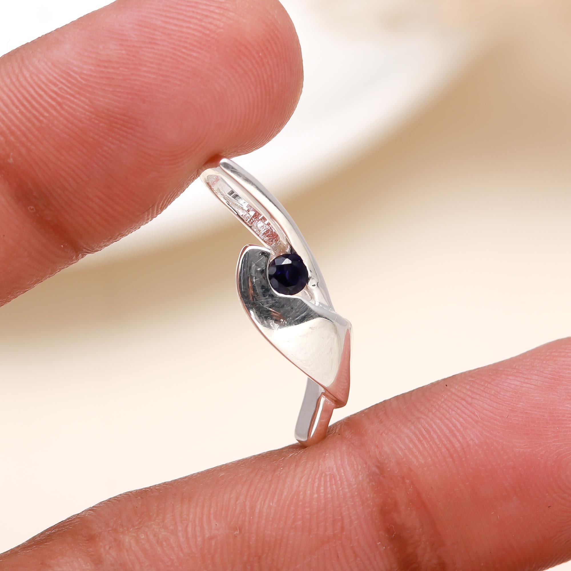 The Sculptural Fold: Abstract Sterling Silver & Sapphire Pendant