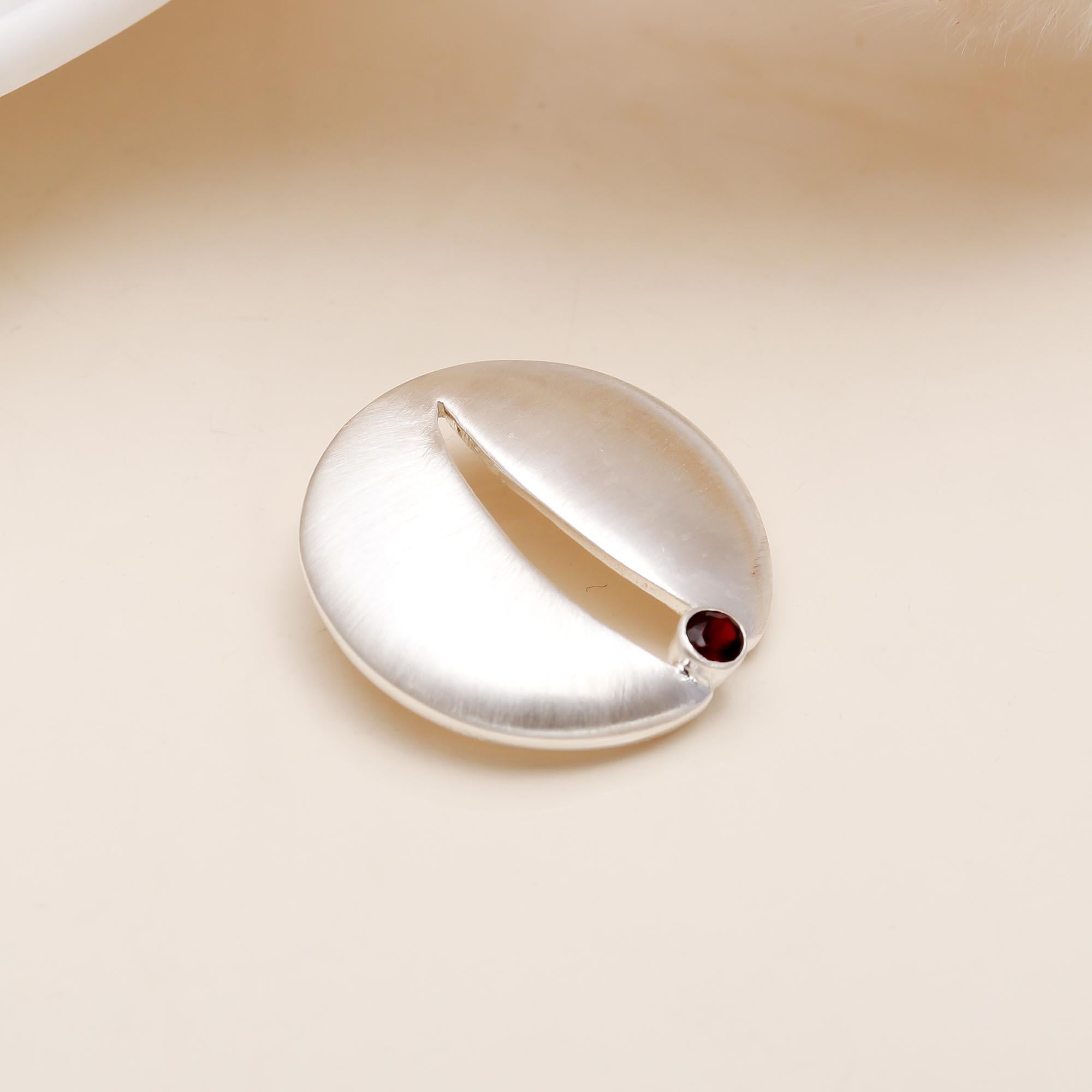 The Sculpted Path: Satin Sterling Silver & Garnet Pendant