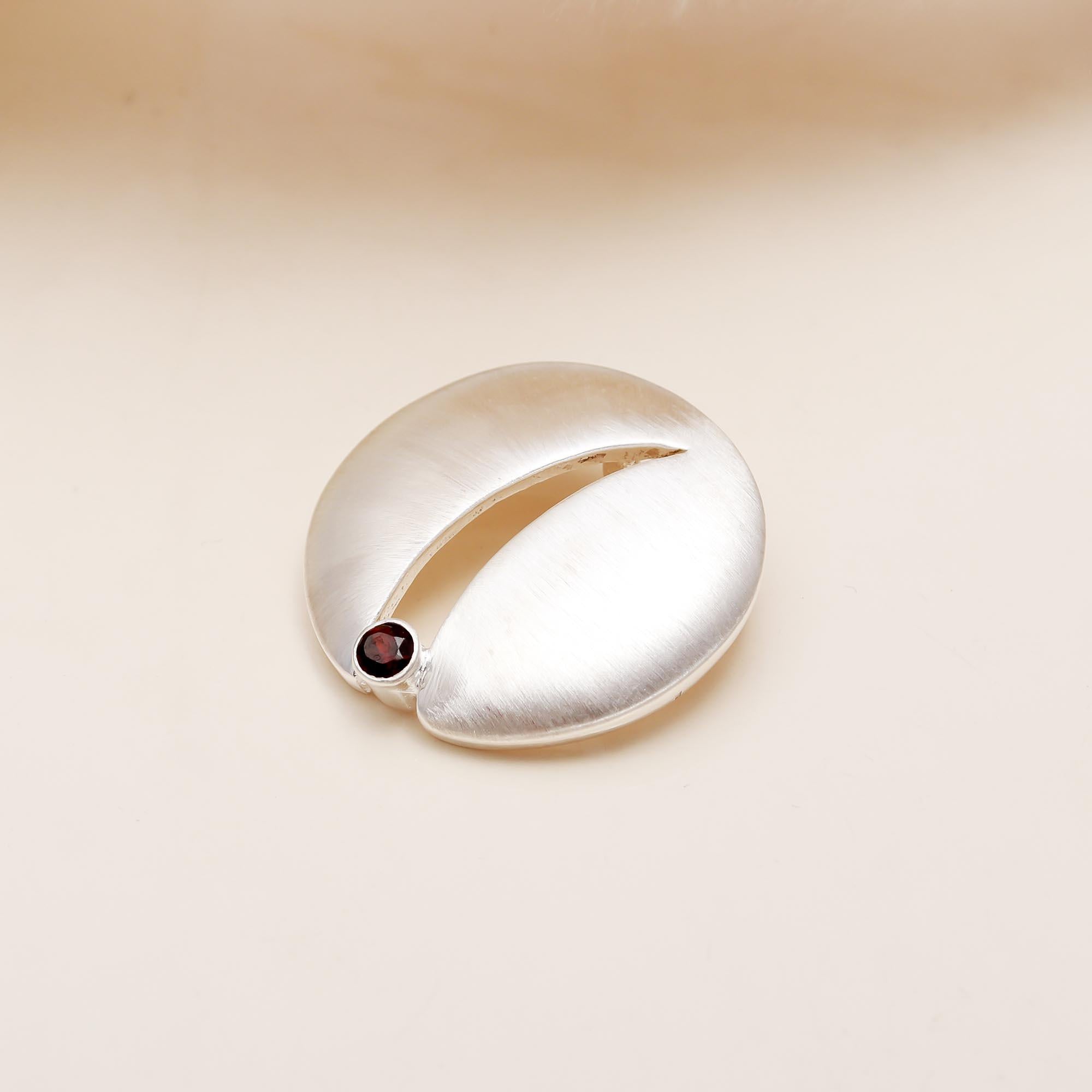 The Sculpted Path: Satin Sterling Silver & Garnet Pendant