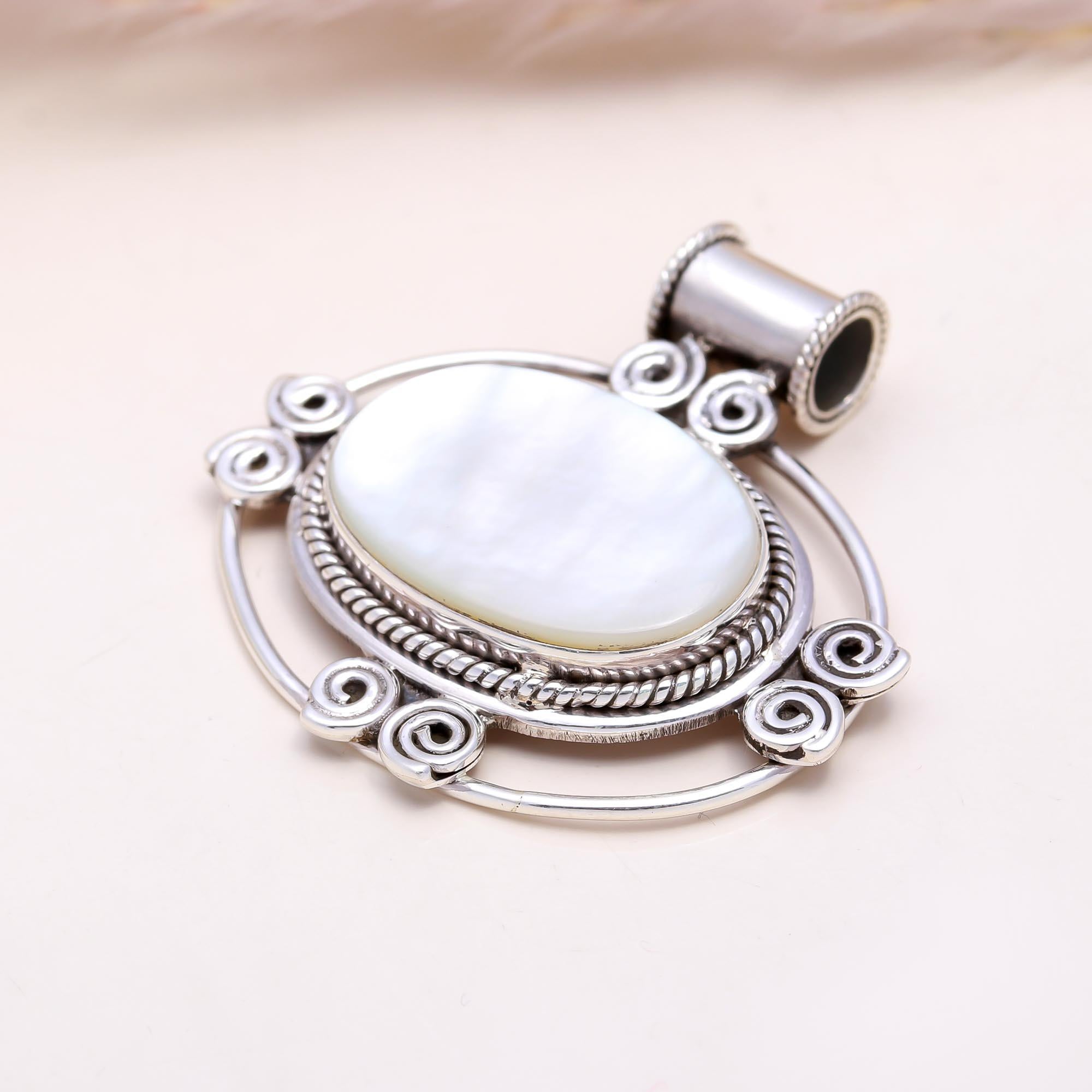 The White Pearl Essence: Mother of Pearl Scrollwork Pendant