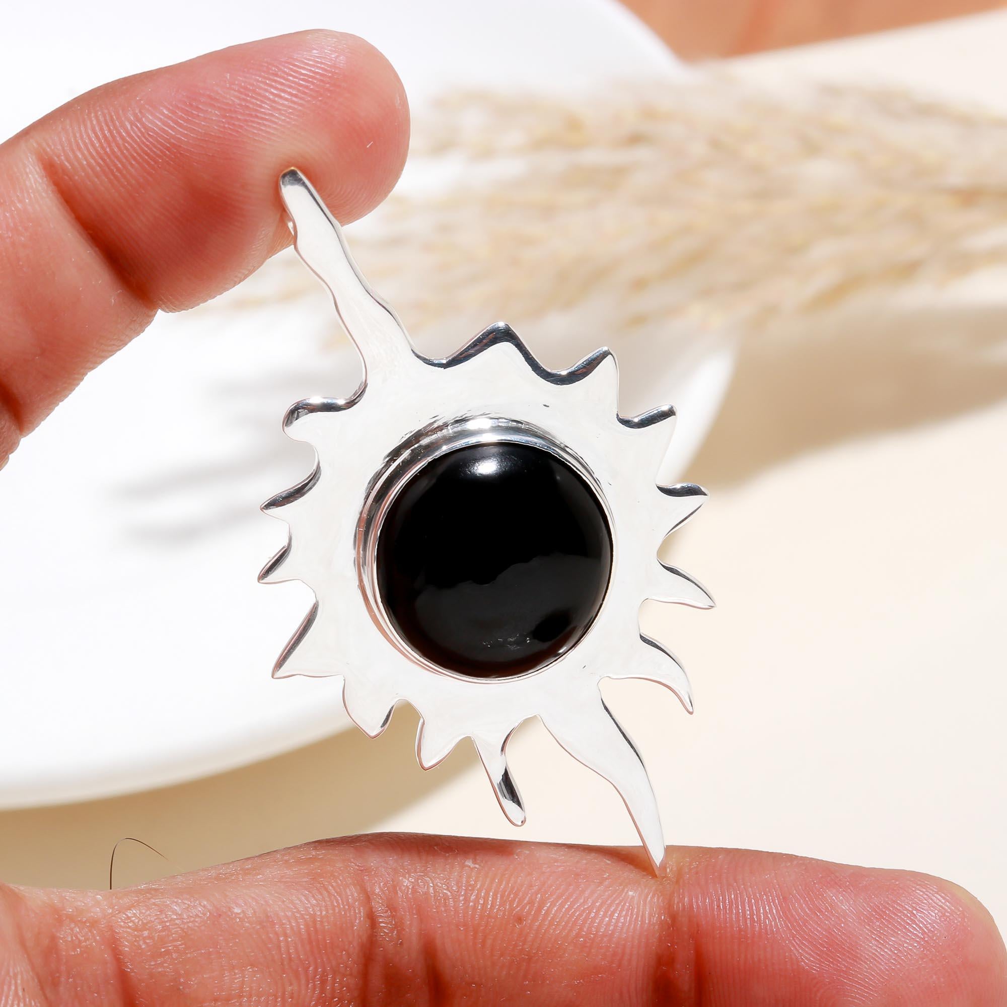 The Onyx Starburst: Celestial Flame Pendant