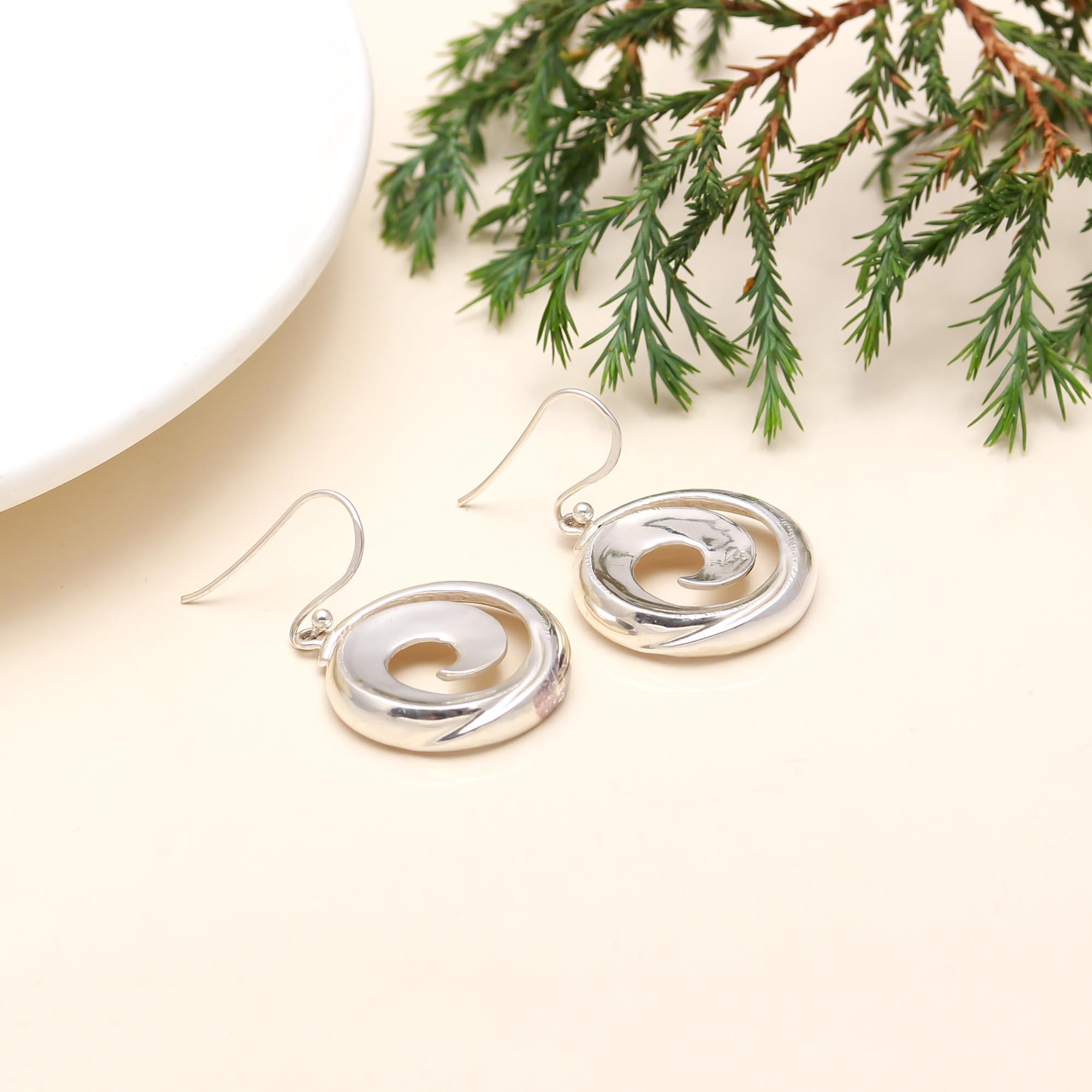 The Sterling Vortex: Polished Silver Spiral Drop Earrings