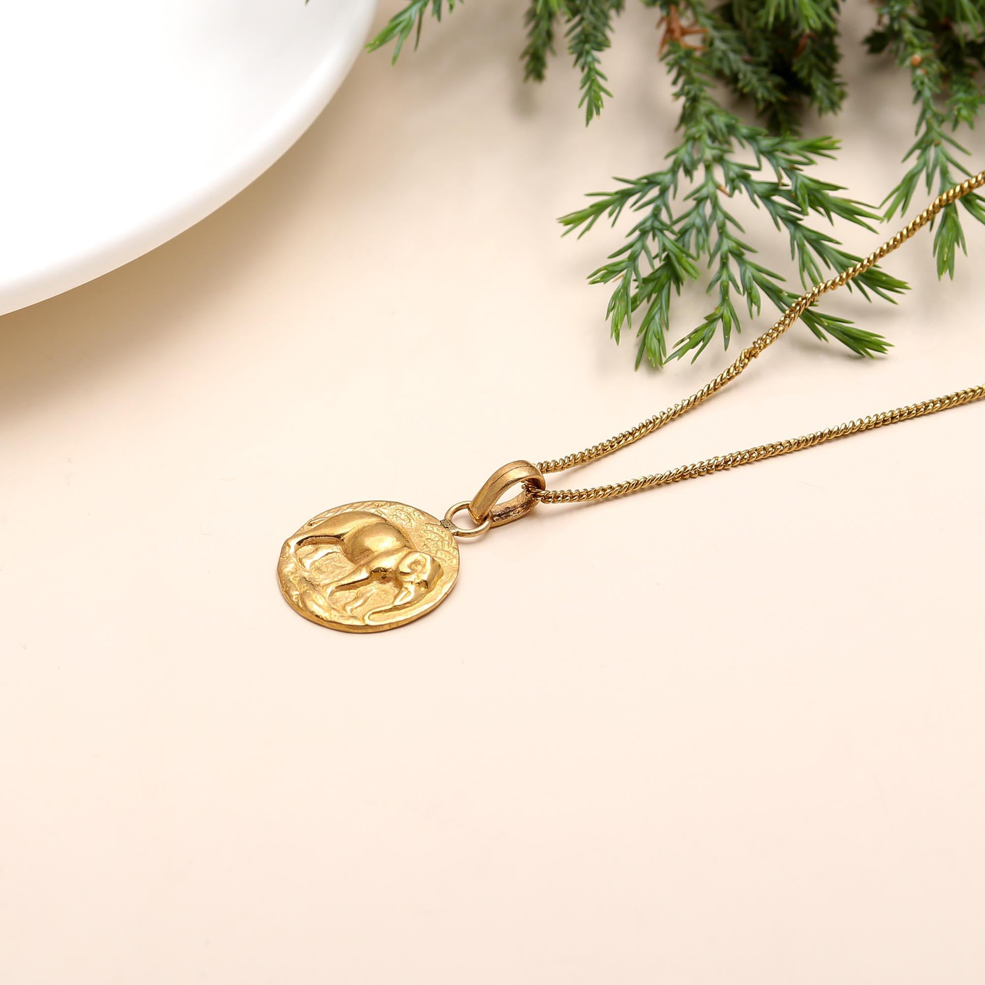 The Golden Guardian: Embossed Elephant Medallion