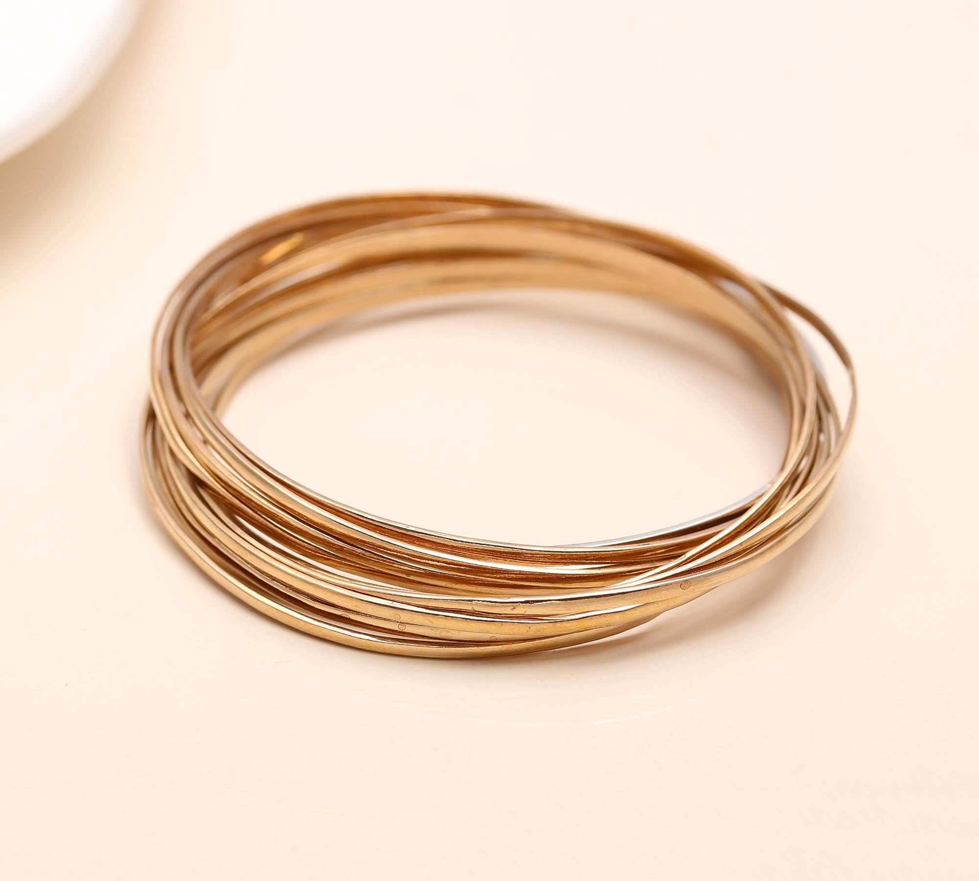 The Gilded Unity: Multi-Strand Gold Interlocking Bangle