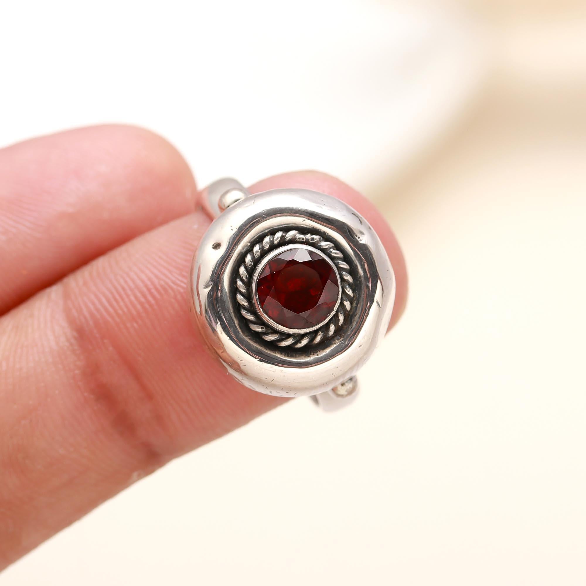 Elegant sterling silver ring with round garnet gemstone