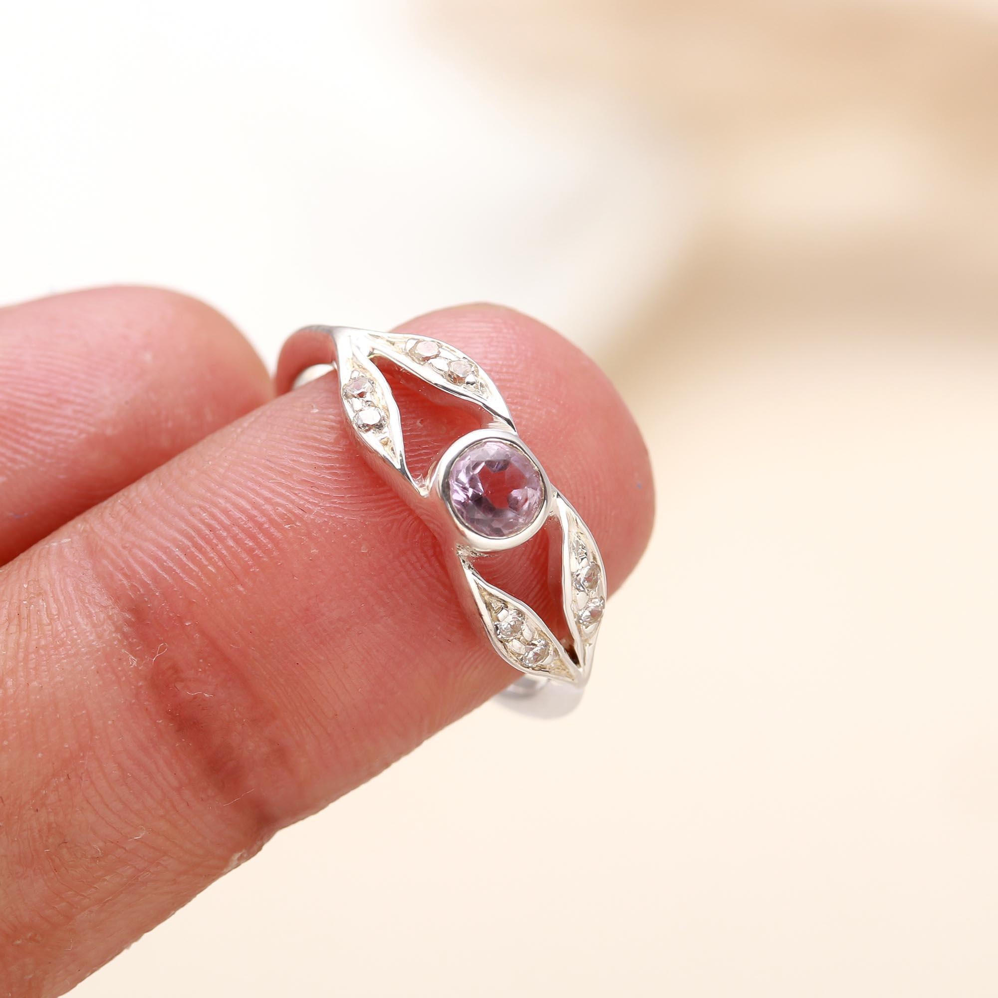 Handcrafted sterling silver ring with amethyst and leaf band