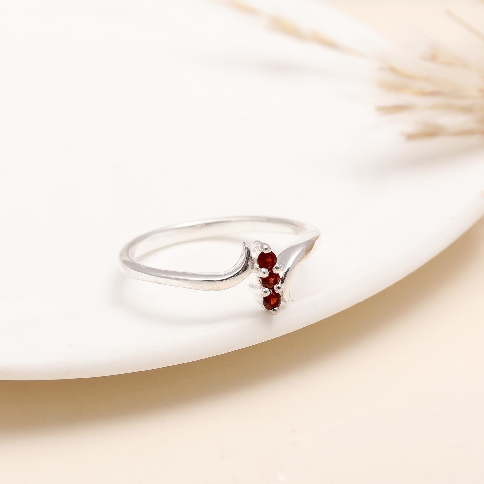 Handcrafted sterling silver ring with garnet solitaire