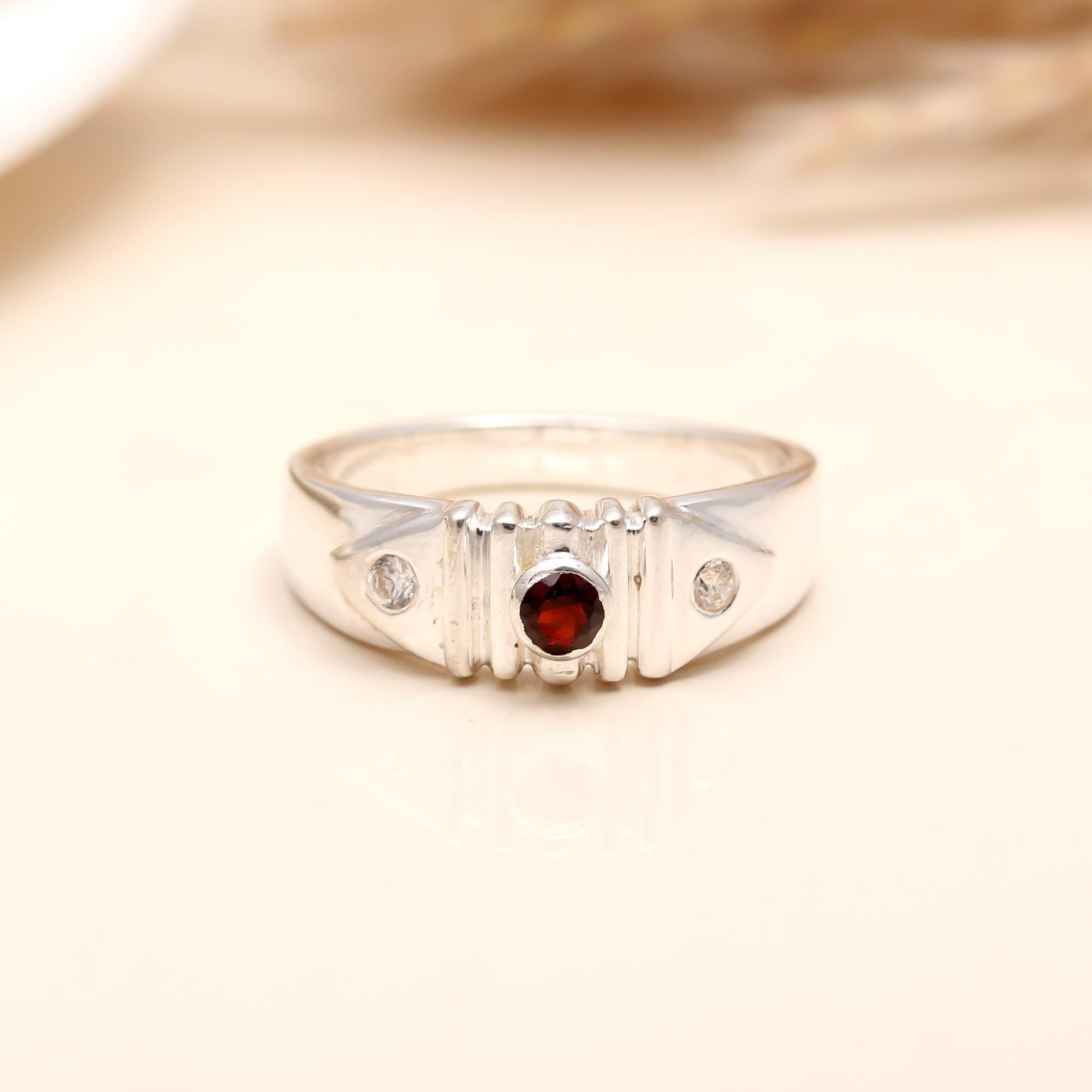 Handcrafted wide silver band ring with garnet gemstone
