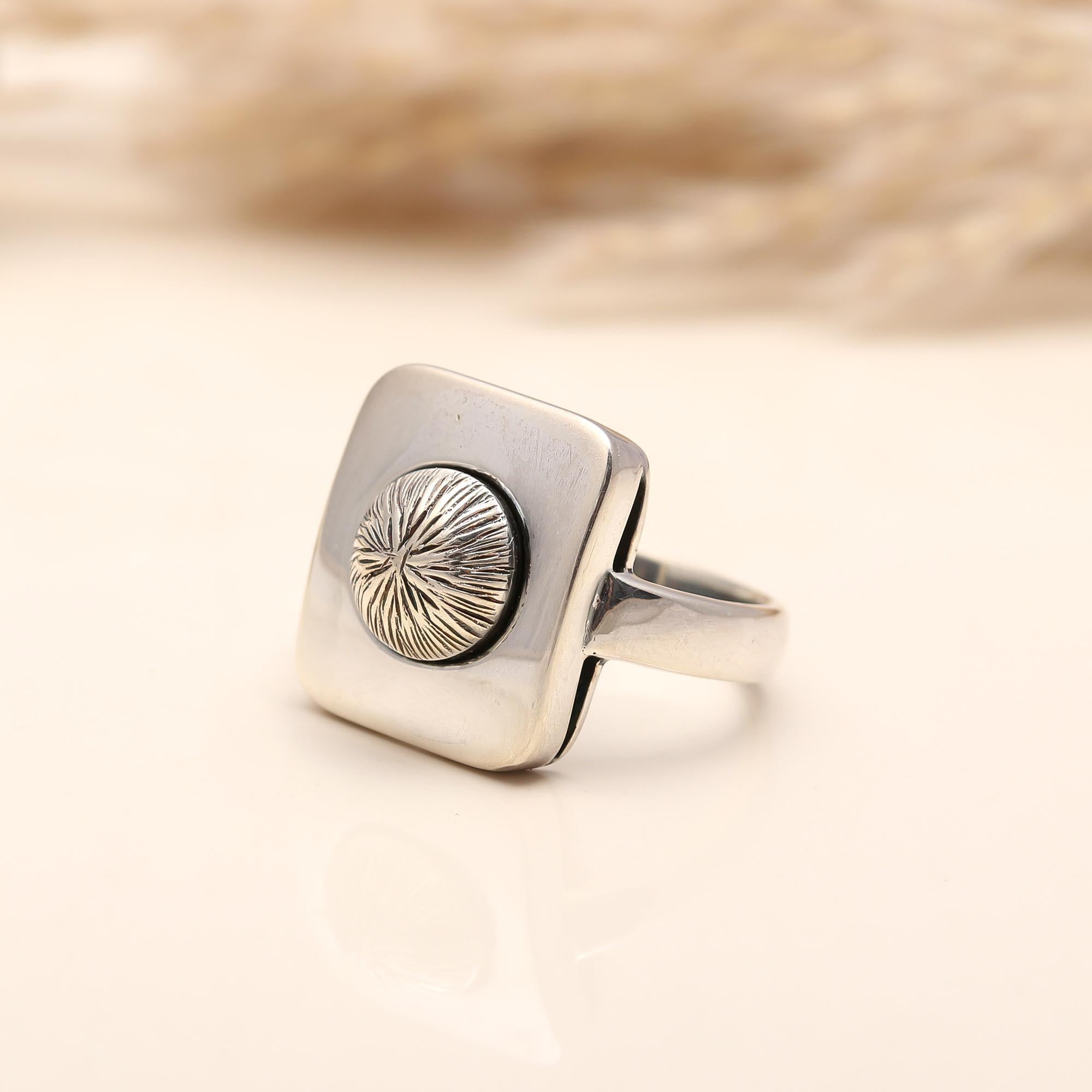 Bold statement silver ring with textured square design