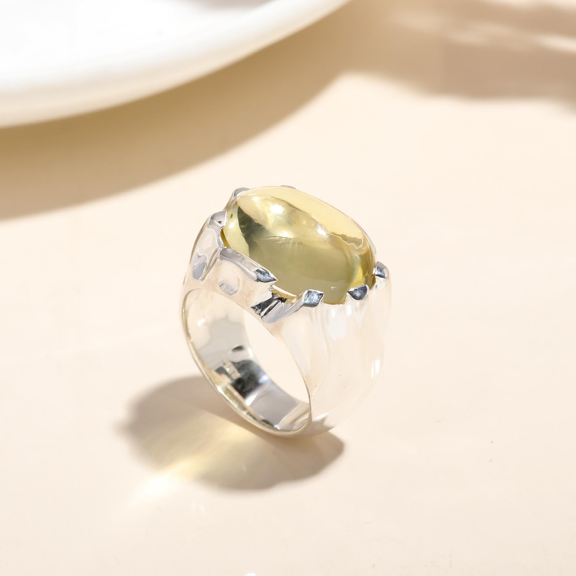 Sterling silver wide band ring with polished green amber