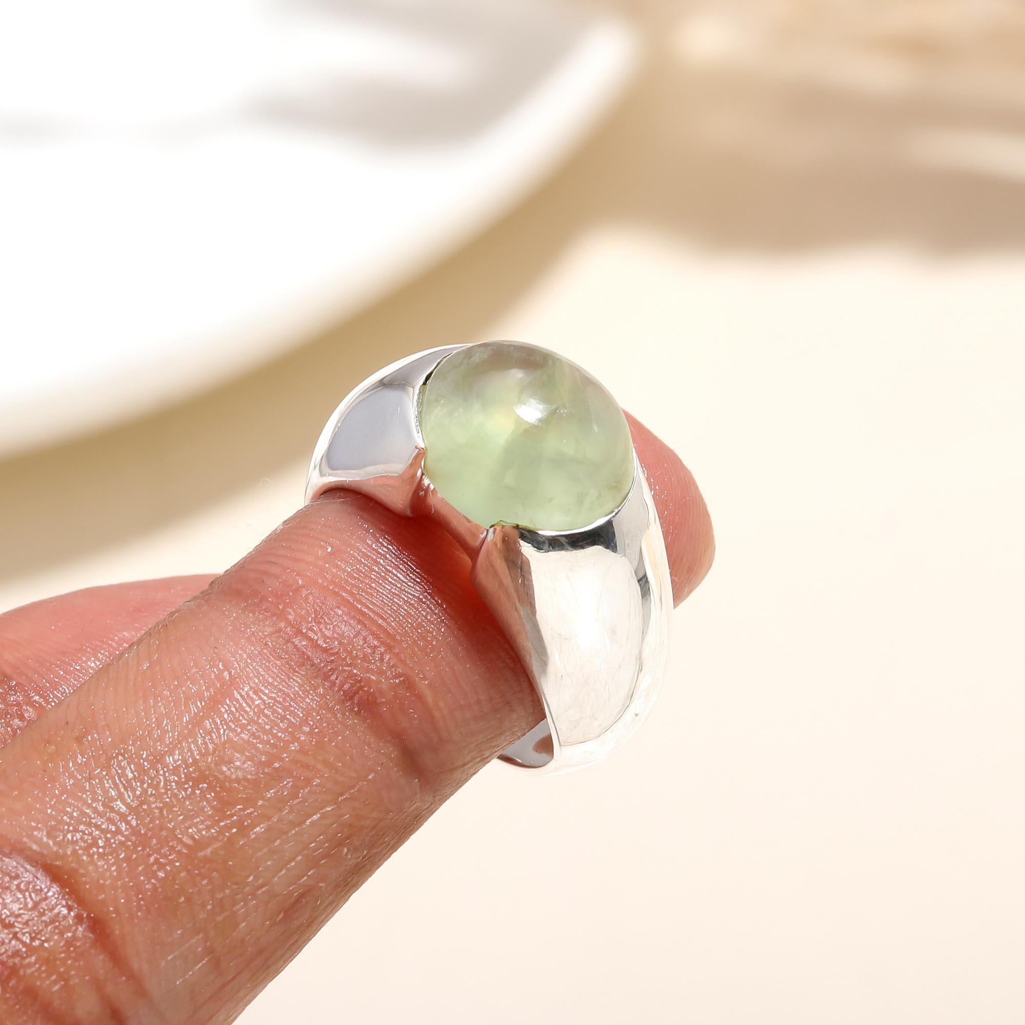 Elegant green prehnite gemstone ring on finger