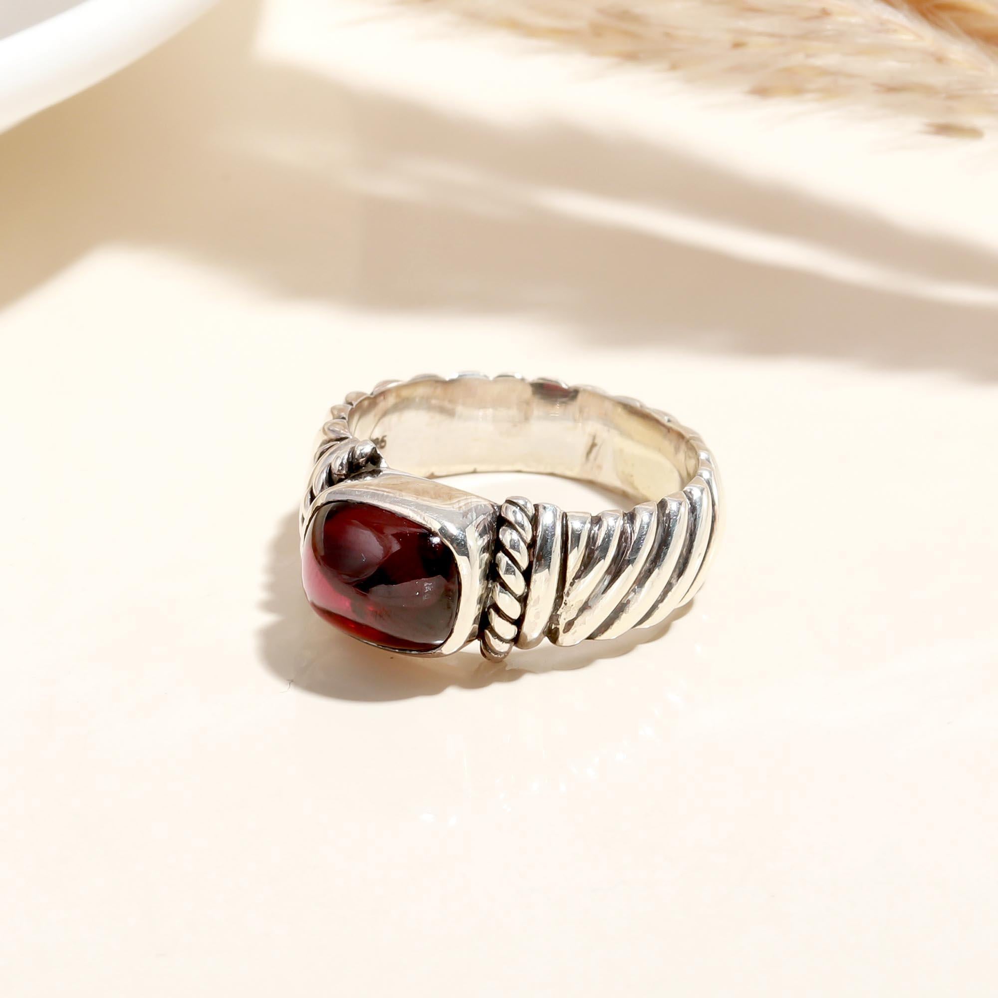 Close-up of Red Garnet rope band ring design