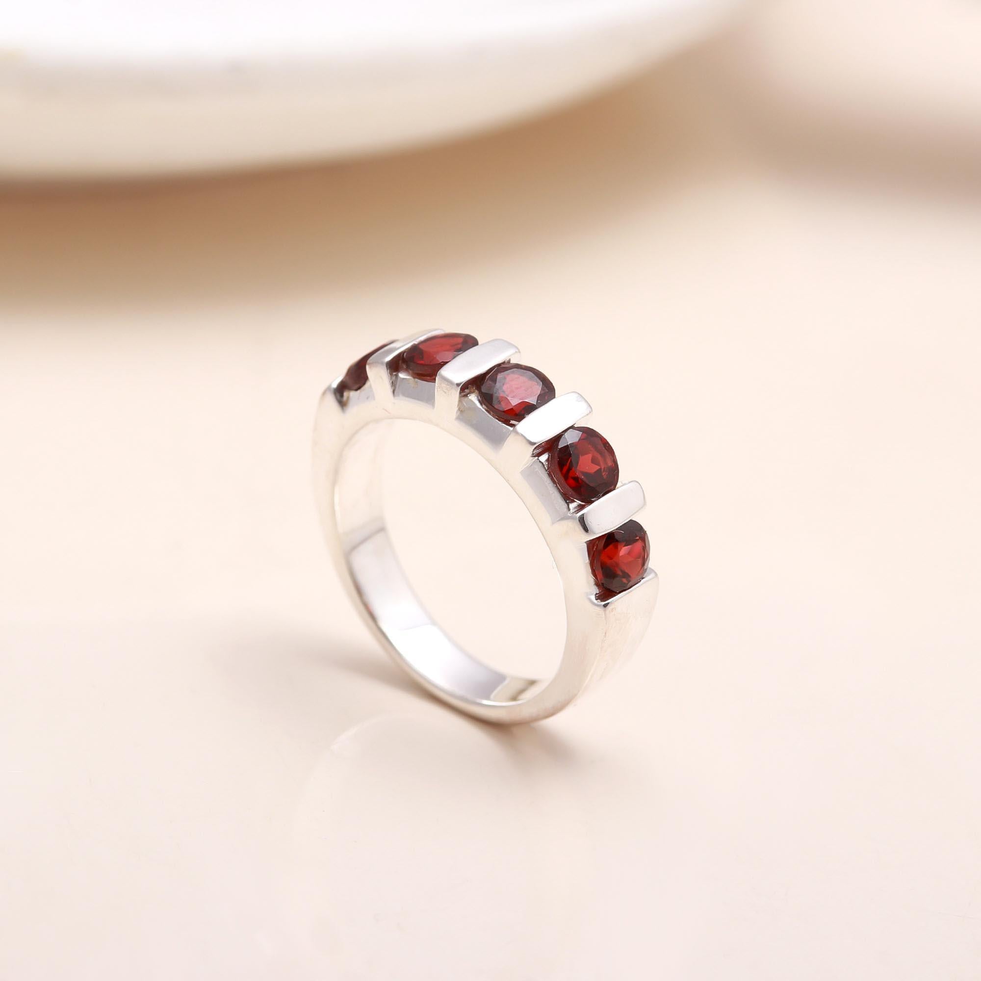 Handmade sterling silver eternity ring with garnet stones