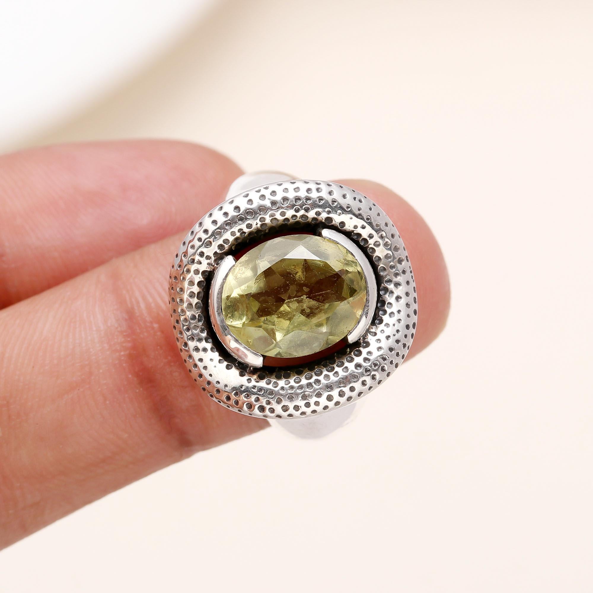 Elegant oval lemon quartz ring on finger