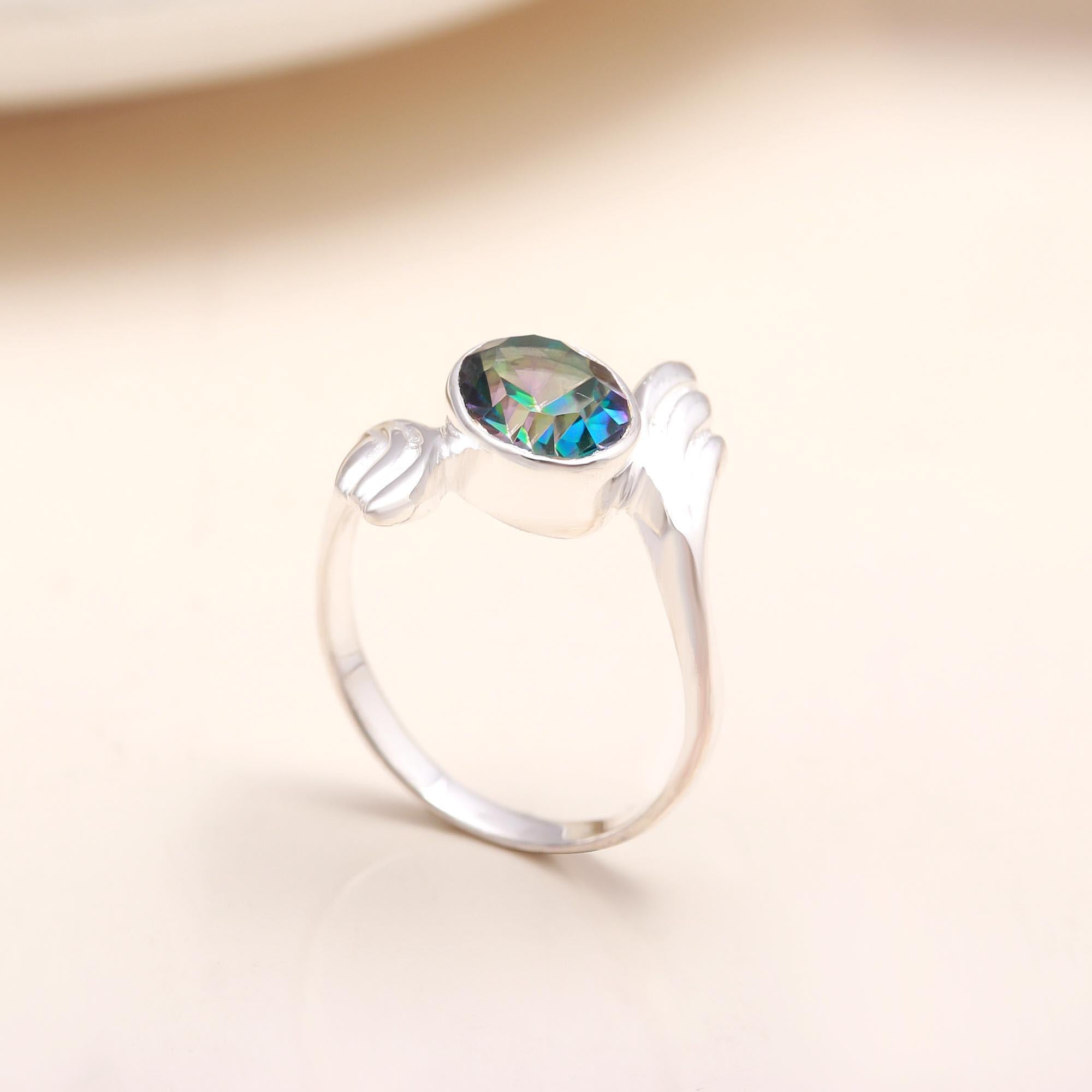 Handmade sterling silver open wing ring with mystic topaz