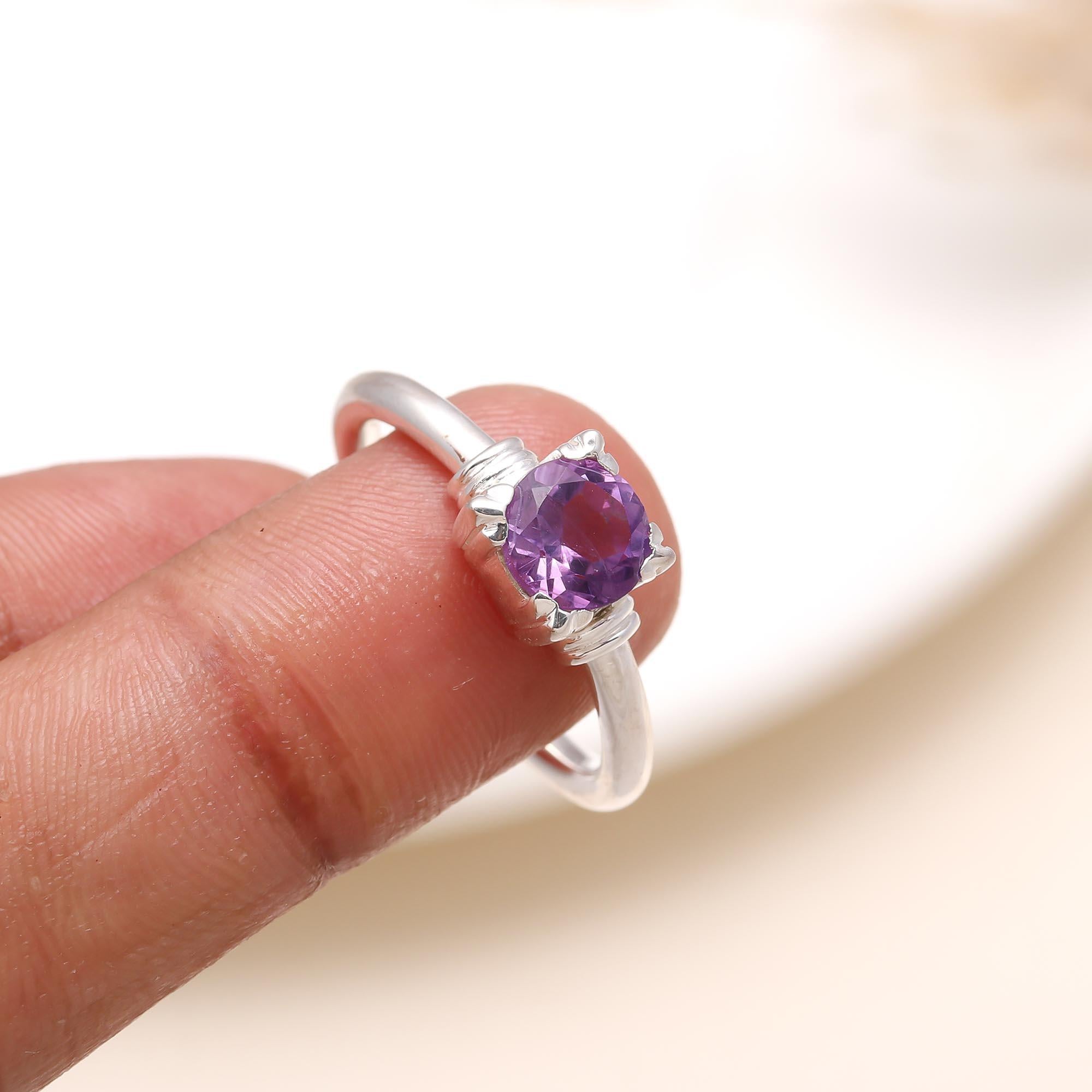 Elegant round amethyst gemstone ring on finger