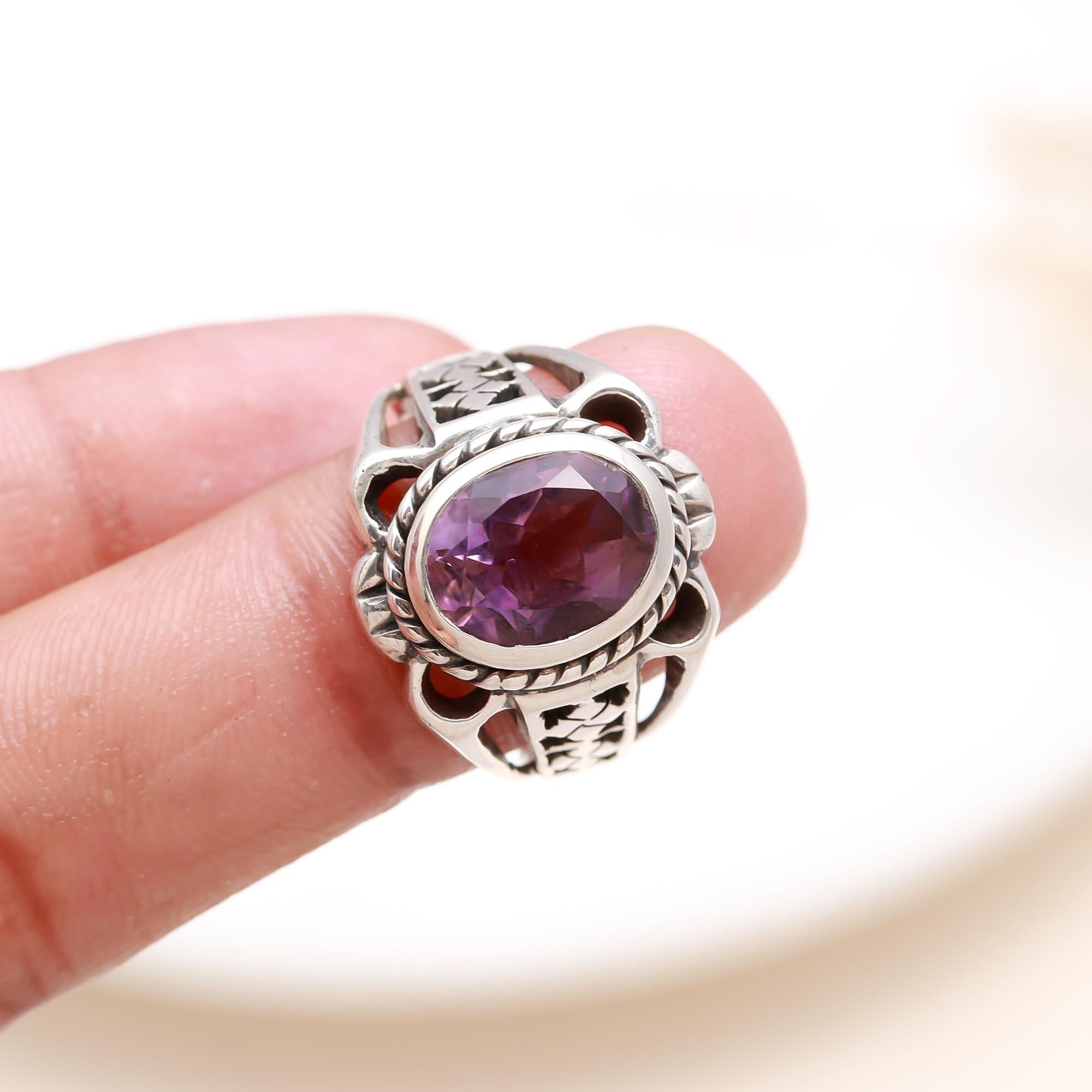 Elegant oval amethyst ring on finger
