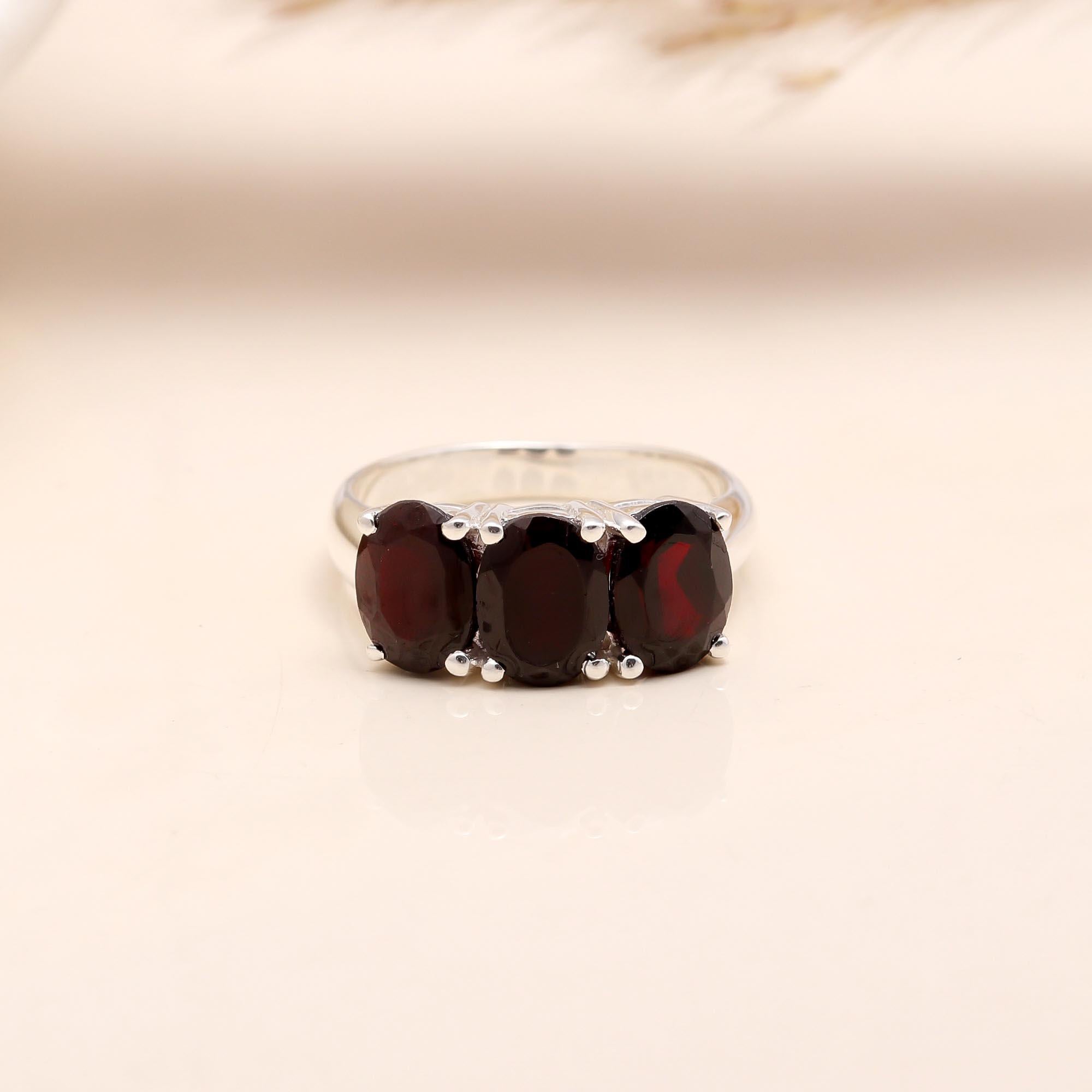 The Crimson Three: Oval Garnet Trio Ring