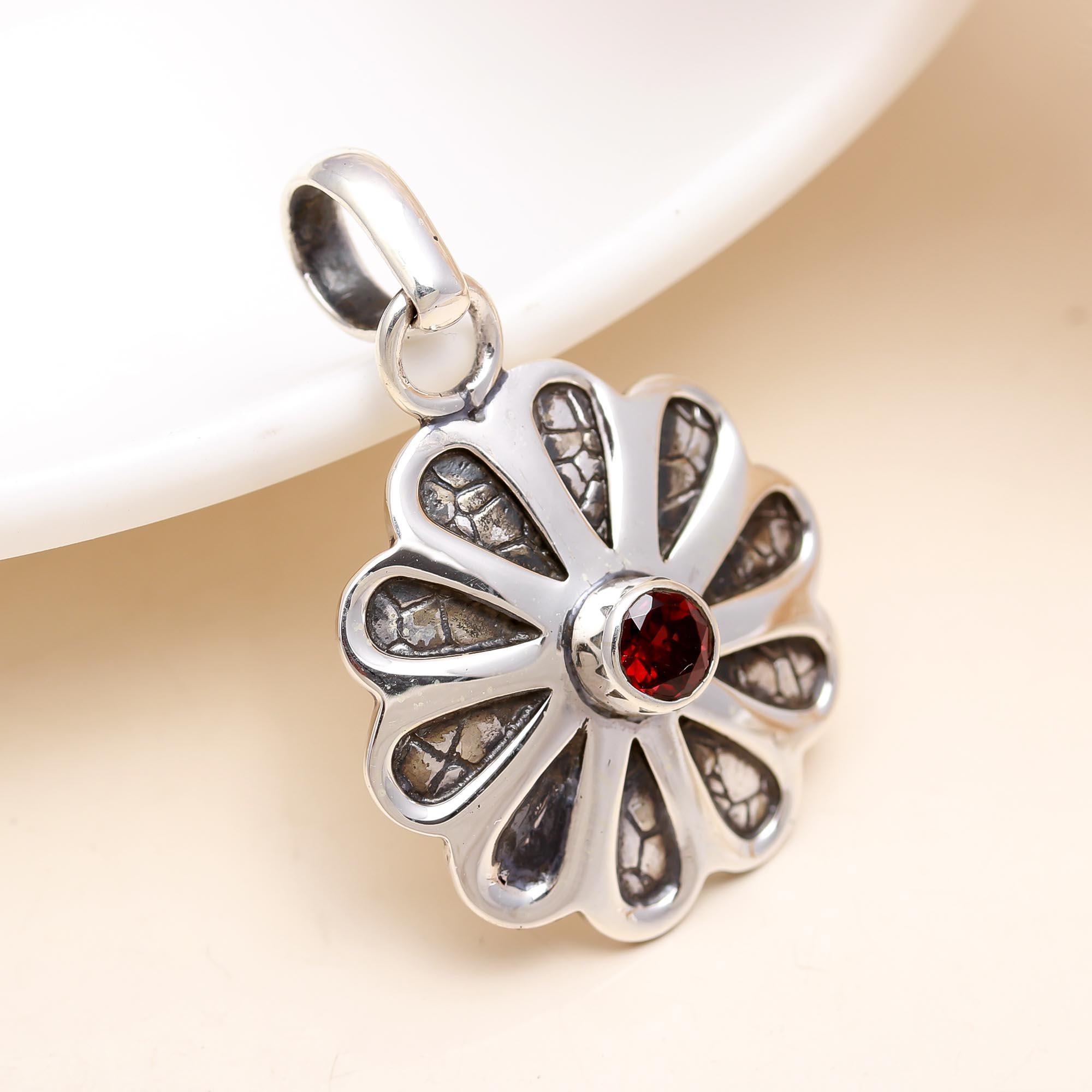 The Textured Blossom Pendant: Textured Silver Garnet Flower Pendant