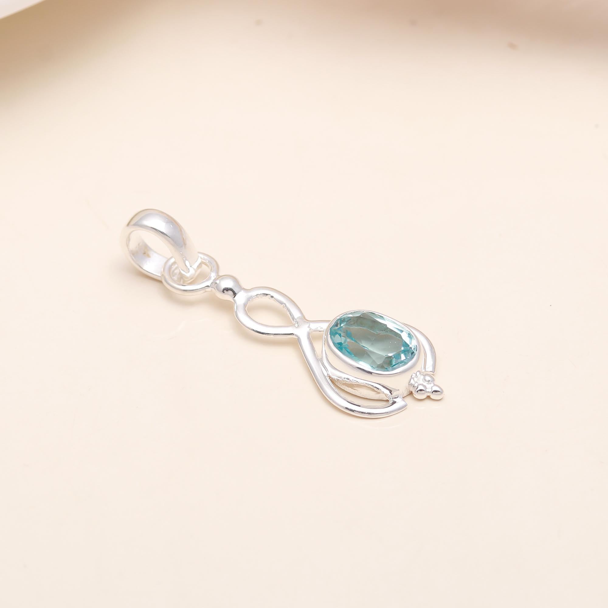 The Azure Infinity: Blue Topaz Elegant Loop Pendant