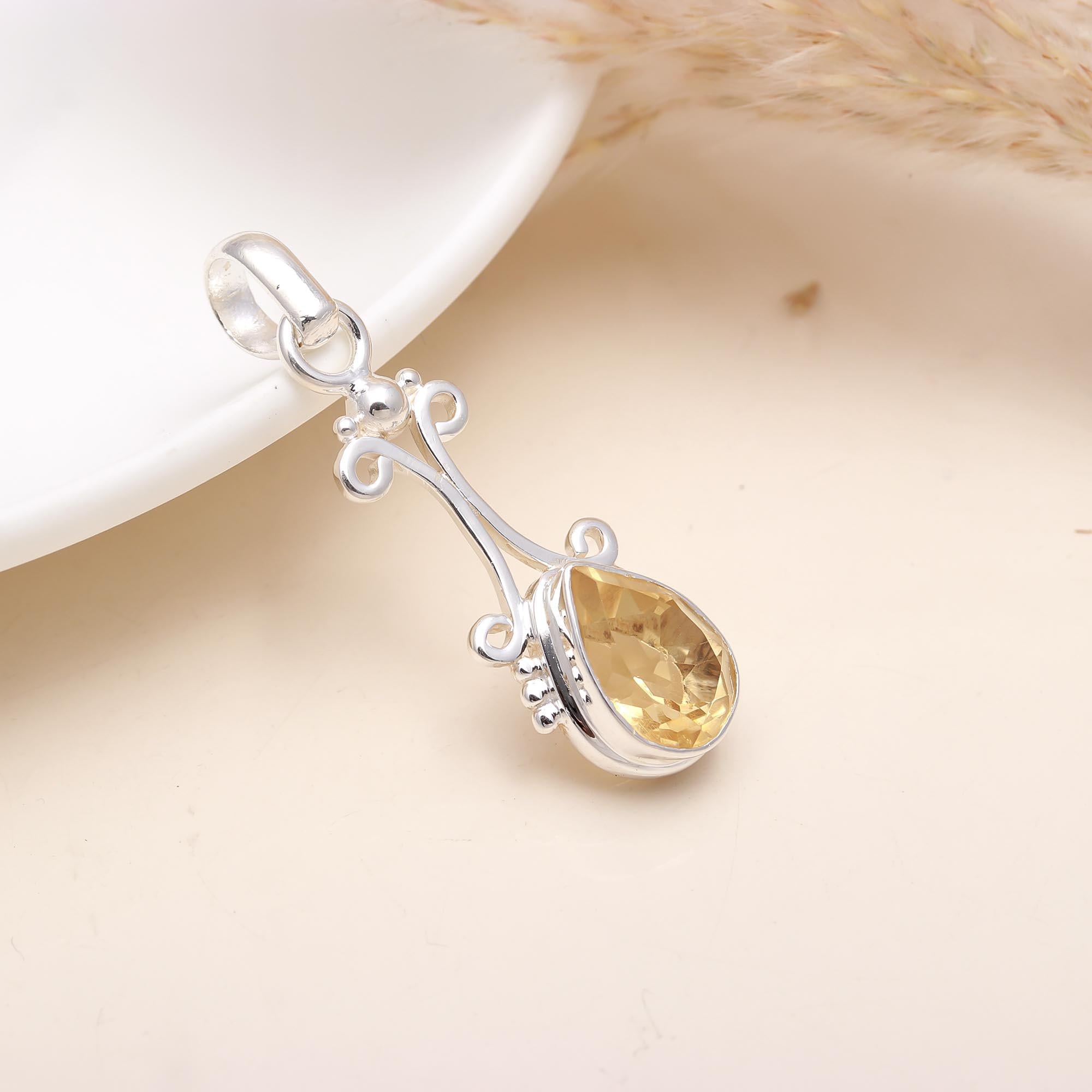 The Golden Drop: Citrine & Silver Scroll Pendant