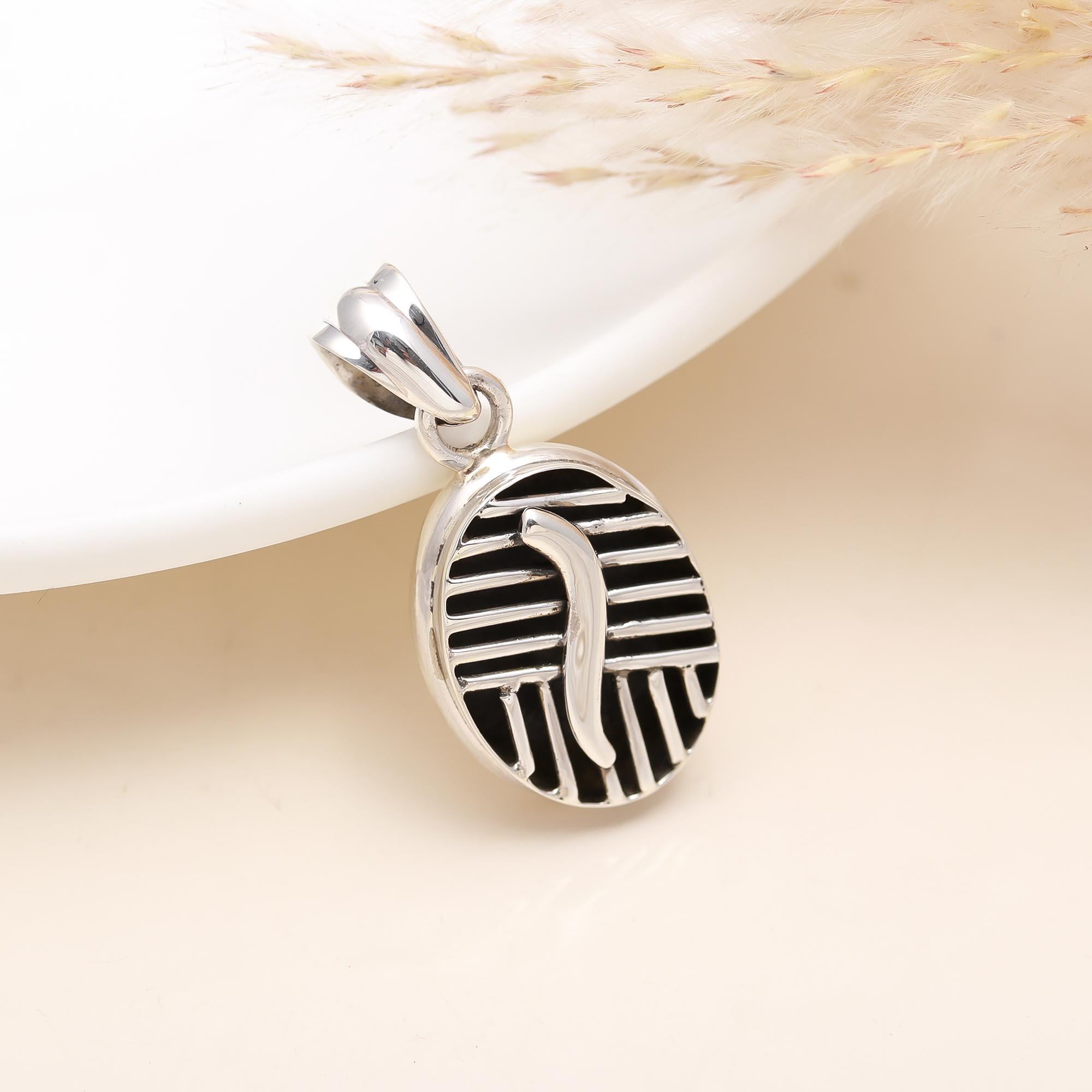 The Modern Labyrinth: Geometric Silver & Black Oval Pendant