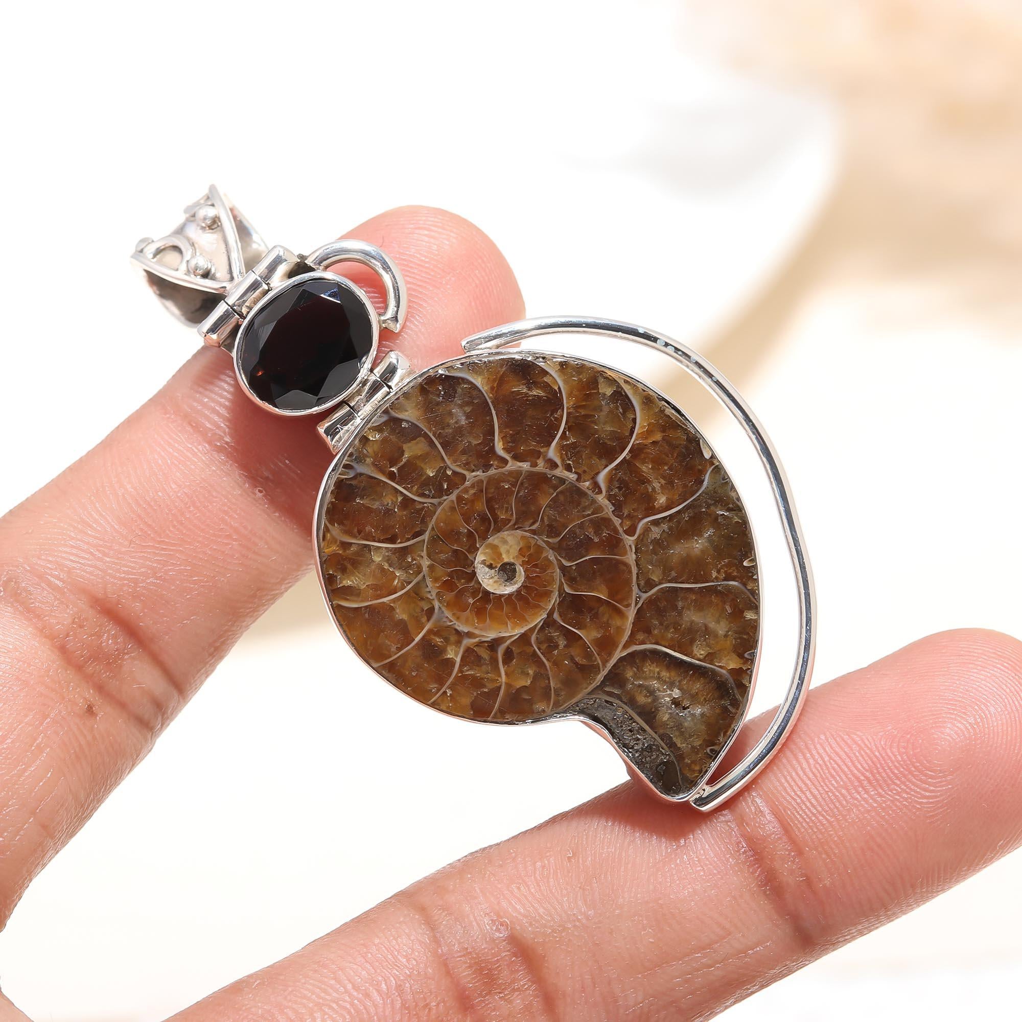 The Primordial Spiral: Sterling Silver Ammonite & Garnet Pendant