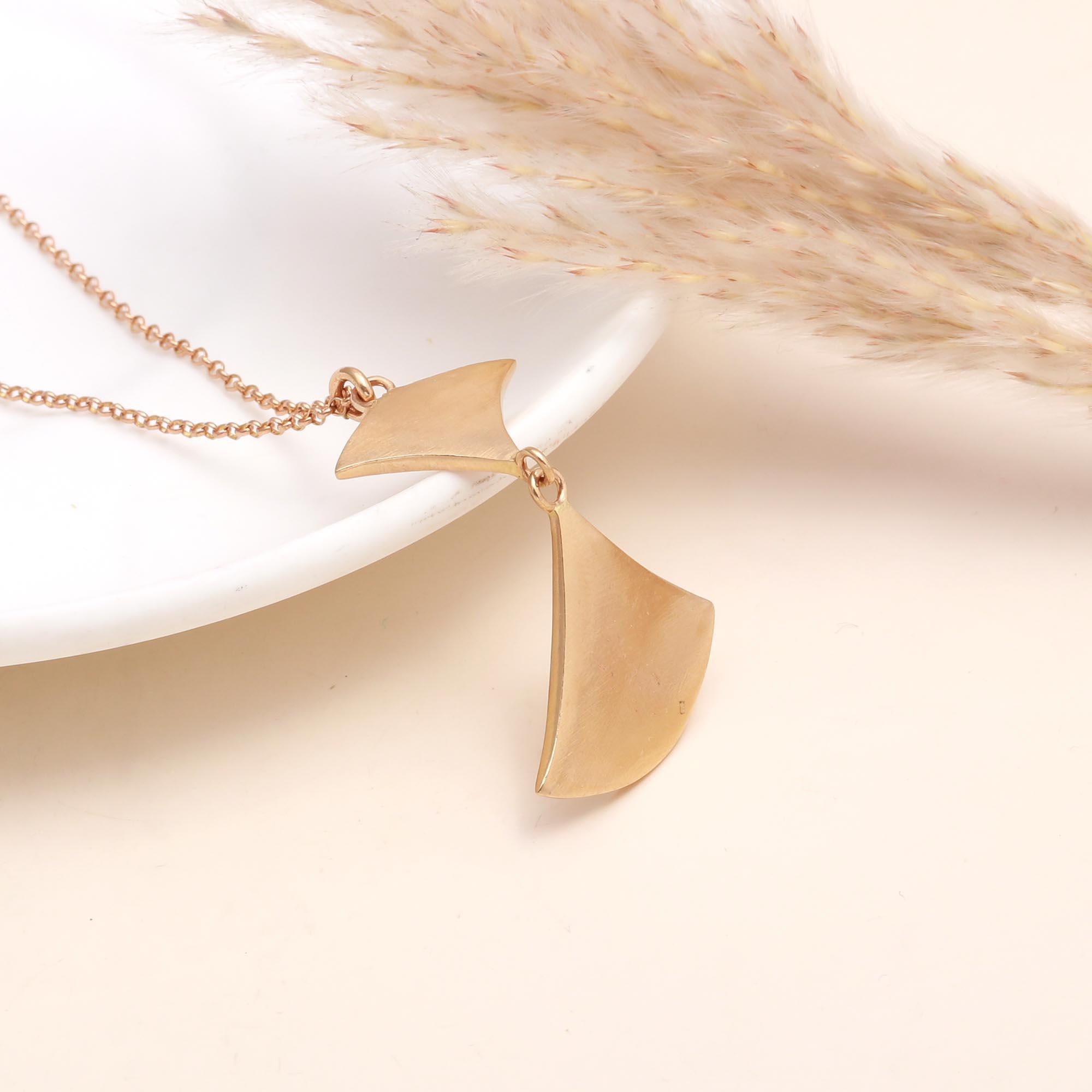 The Modern Wing: Geometric Gold Abstract Necklace