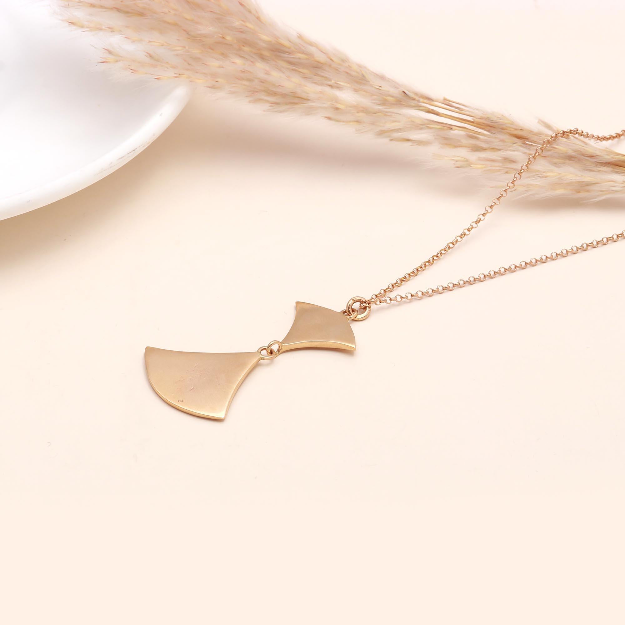 The Modern Wing: Geometric Gold Abstract Necklace
