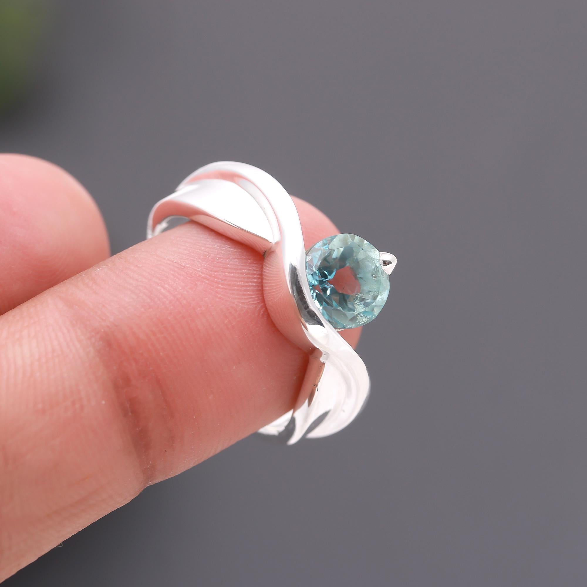 The Azure Swirl: Blue Topaz & Silver Bypass Ring