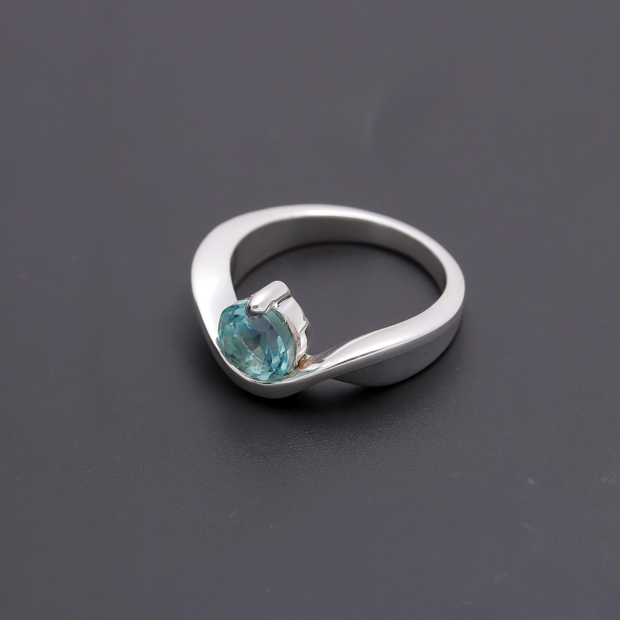 The Azure Swirl: Blue Topaz & Silver Bypass Ring
