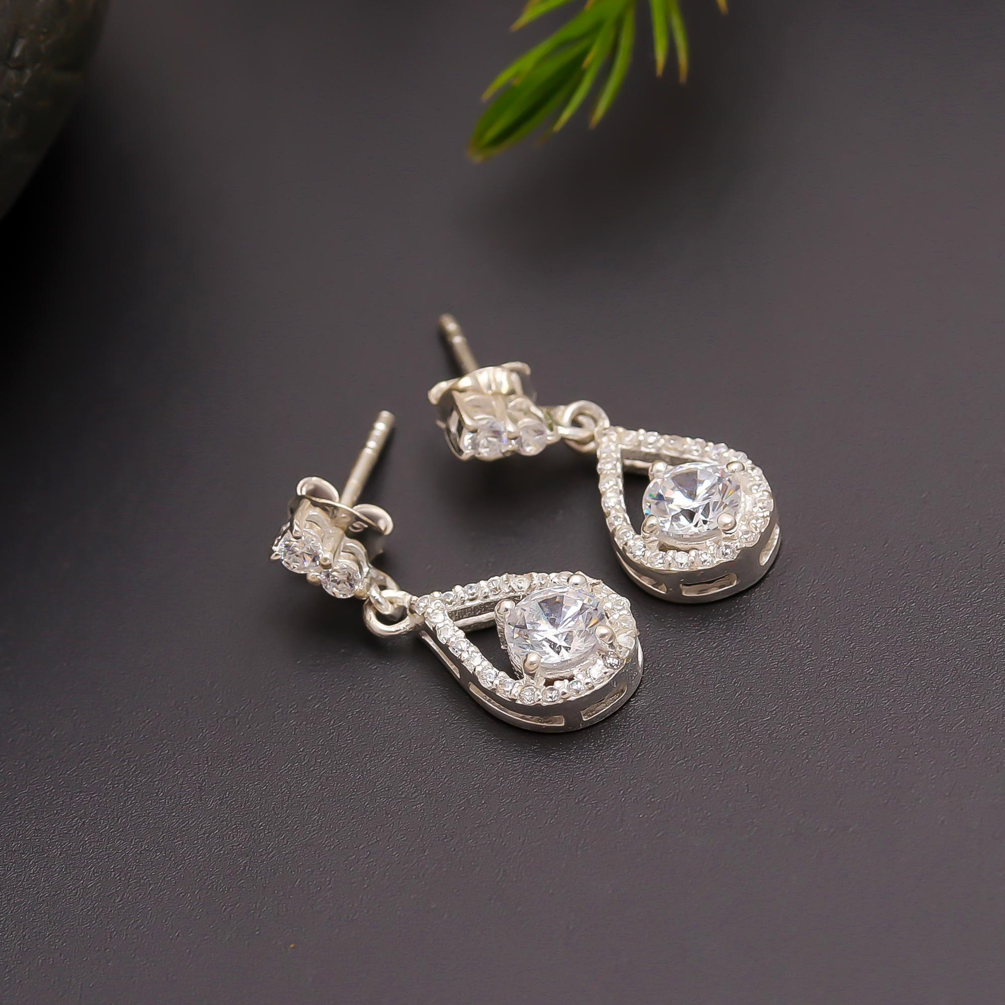 The Crystal Cascade: Cubic Zirconia & Silver Halo stud Earrings