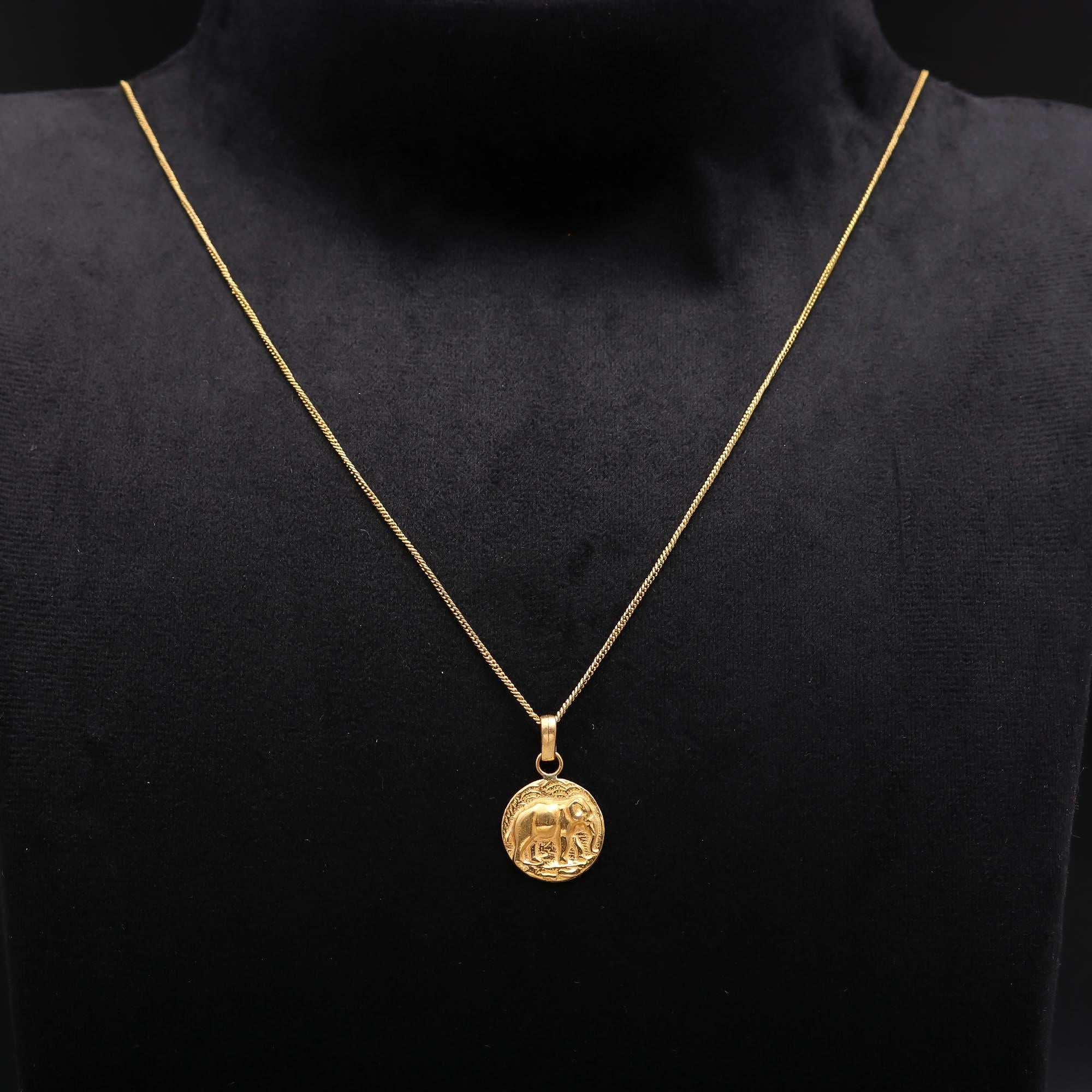 The Golden Guardian: Embossed Elephant Medallion