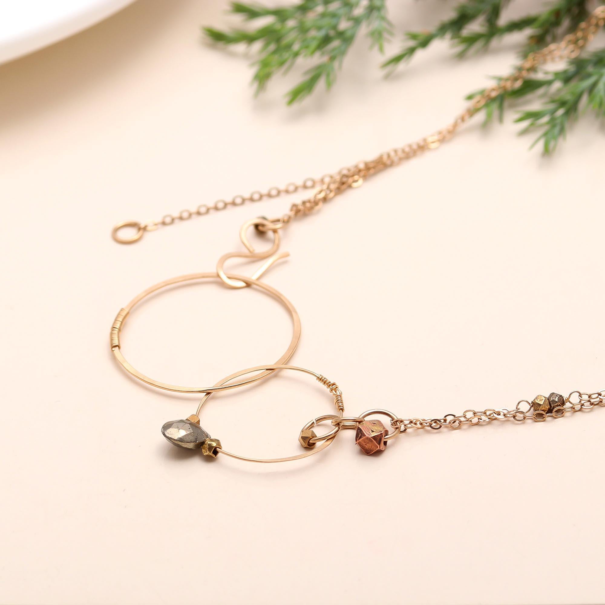The Orbiting Spheres: Pyrite & Gold Circle Lariat