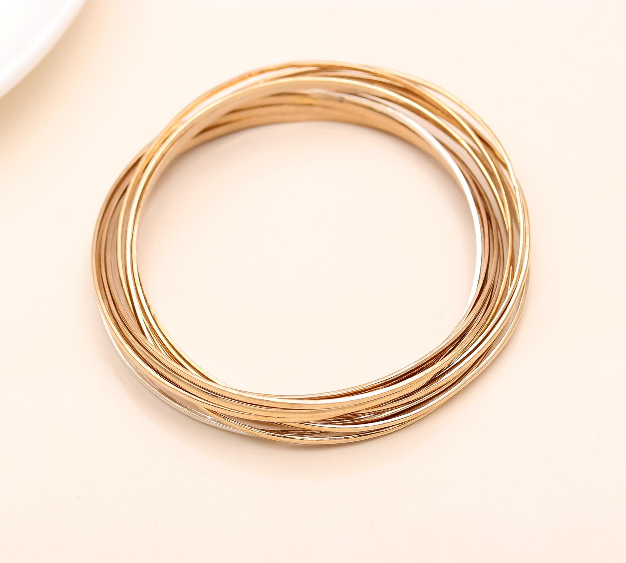 The Gilded Unity: Multi-Strand Gold Interlocking Bangle