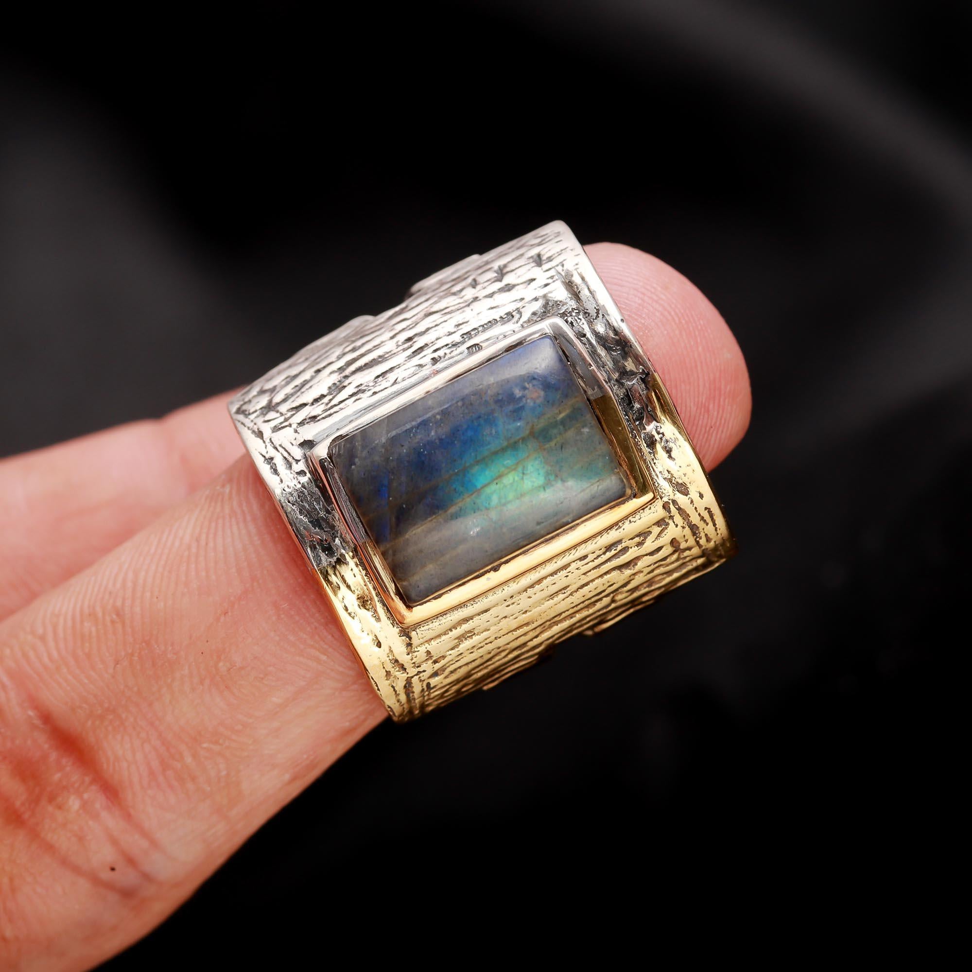 Large labradorite silver statement ring on finger