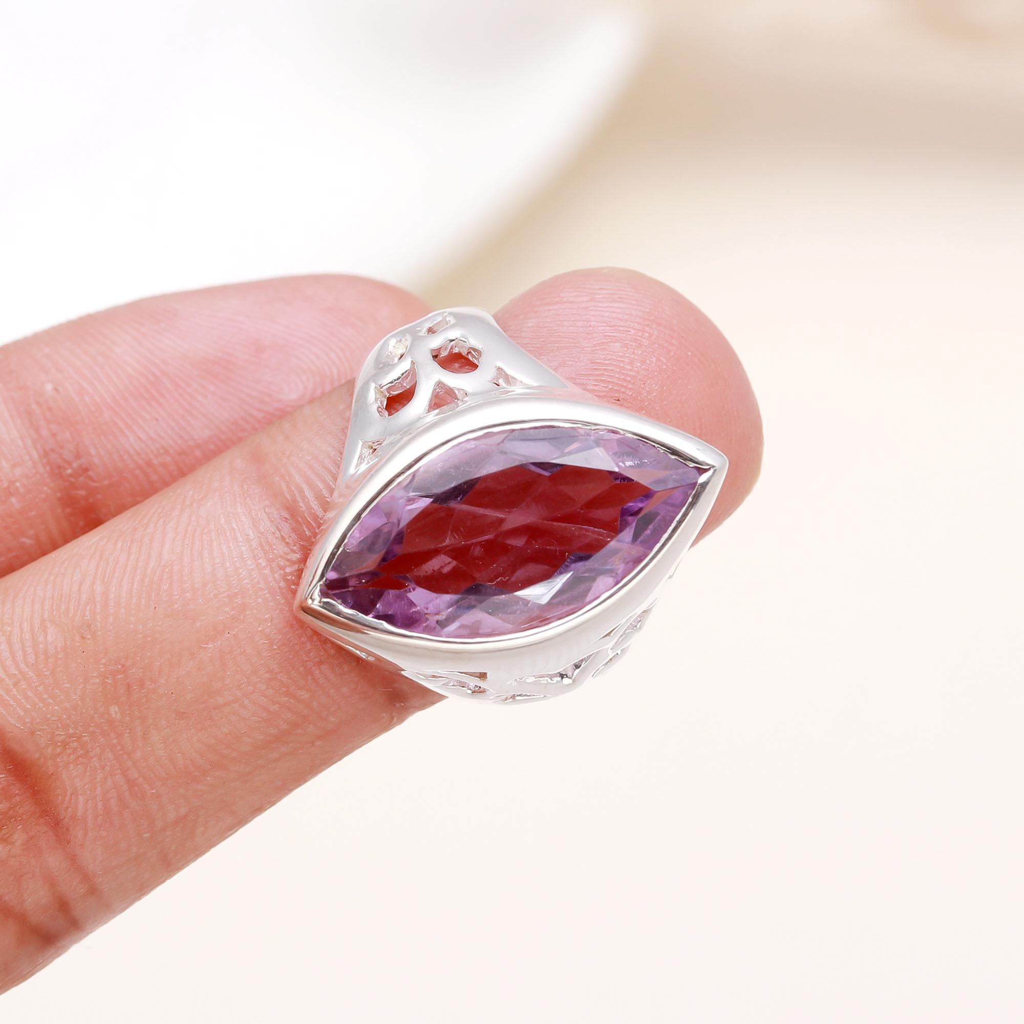 Handmade amethyst silver ring worn on finger