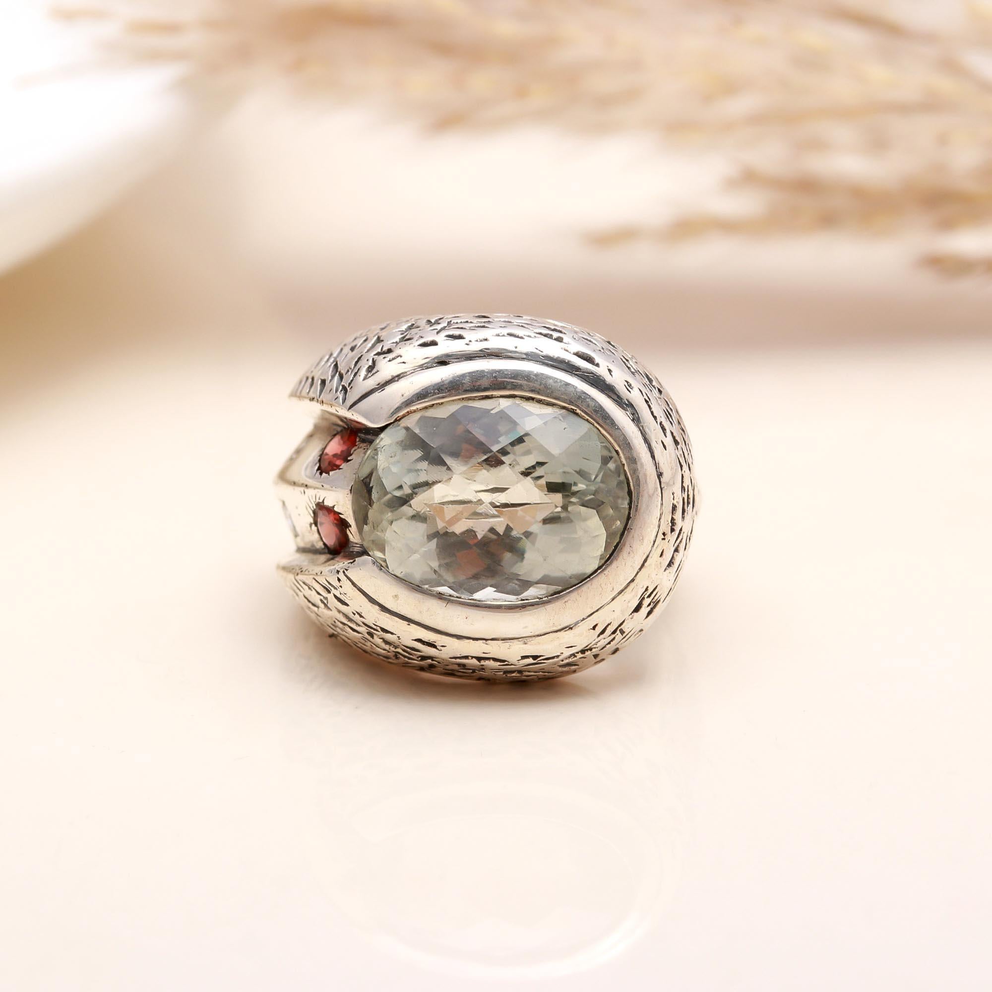 Oval-cut green amethyst set in sterling silver band