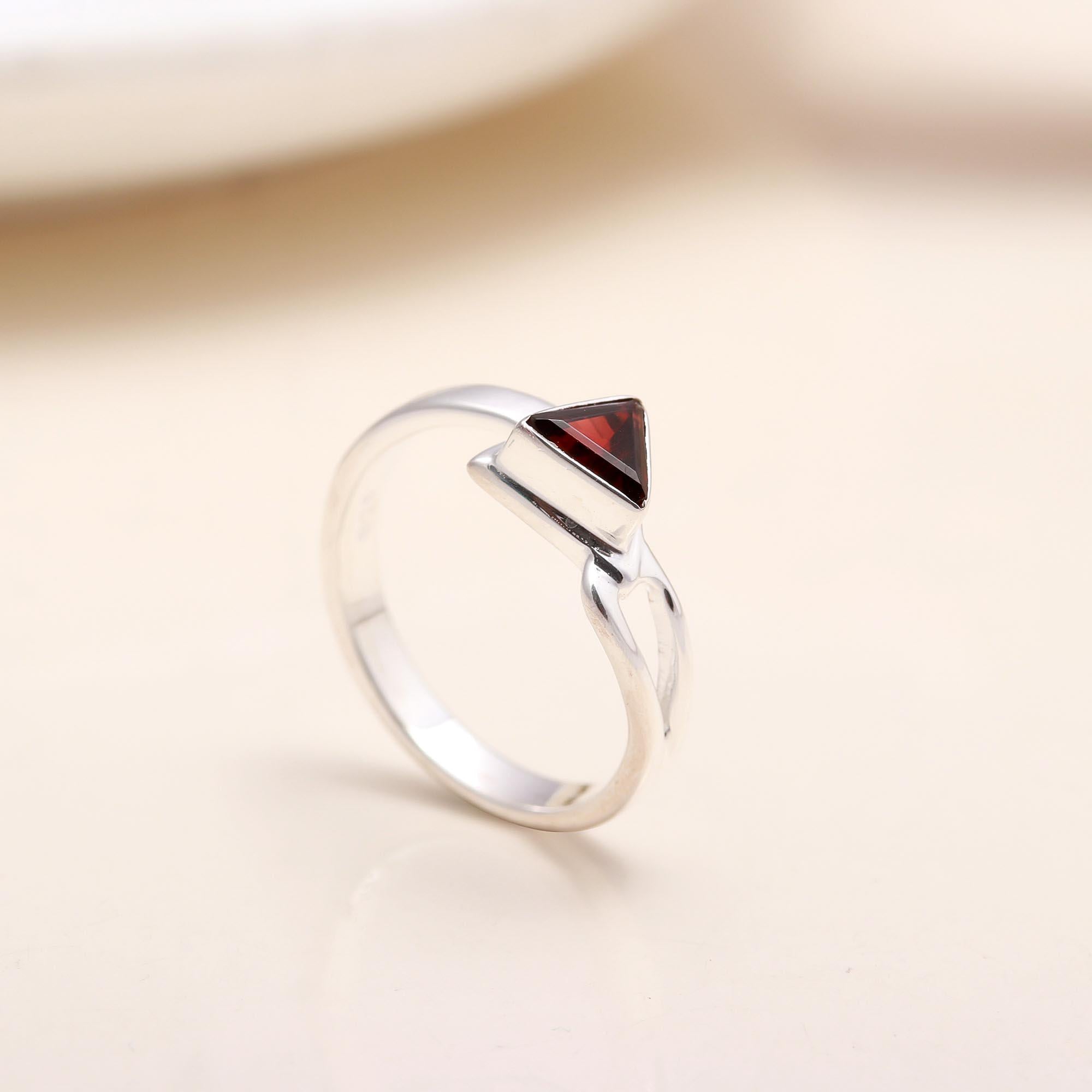 Handmade garnet open band silver ring close-up