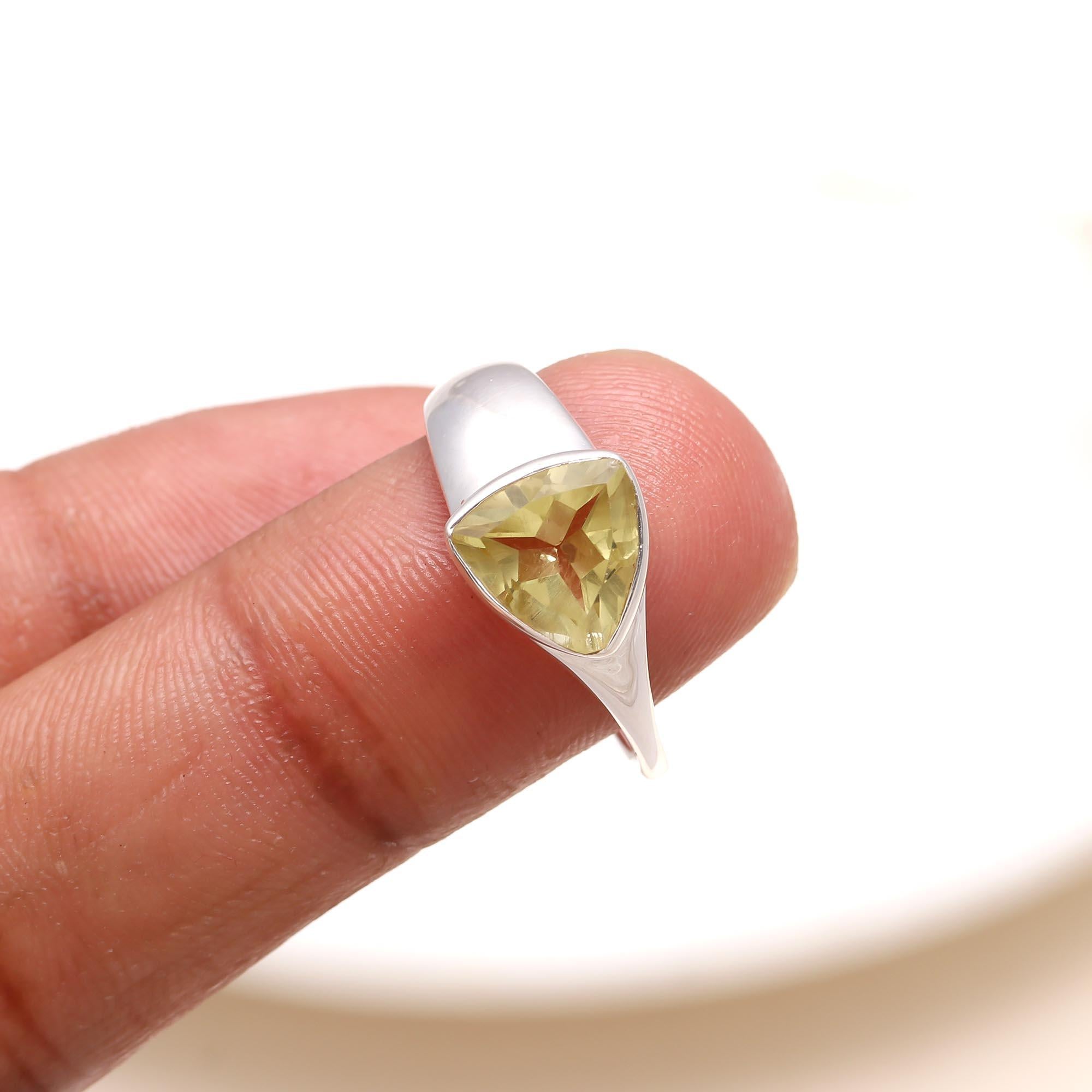 Elegant trillion-cut lemon quartz gemstone ring on finger