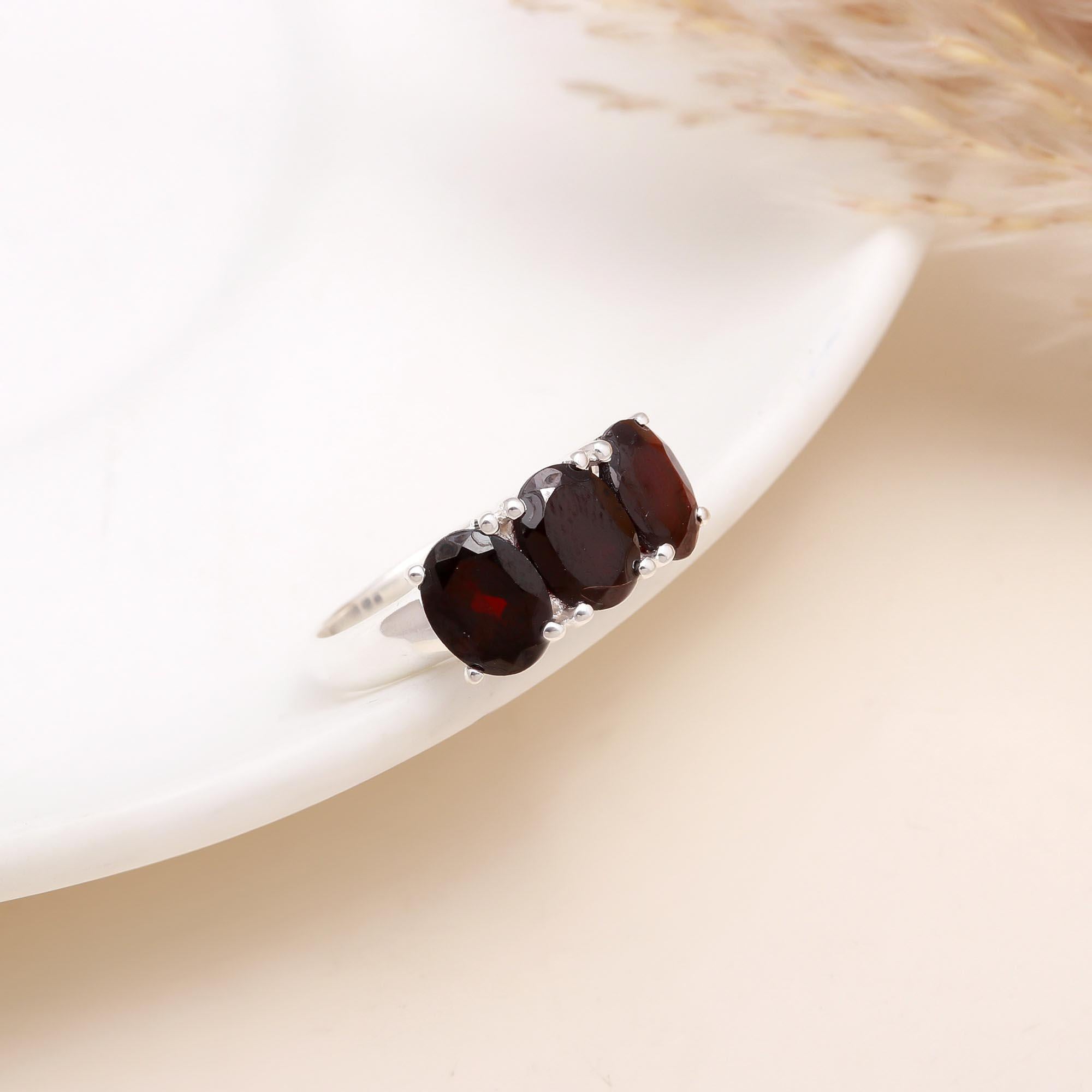 The Crimson Three: Oval Garnet Trio Ring