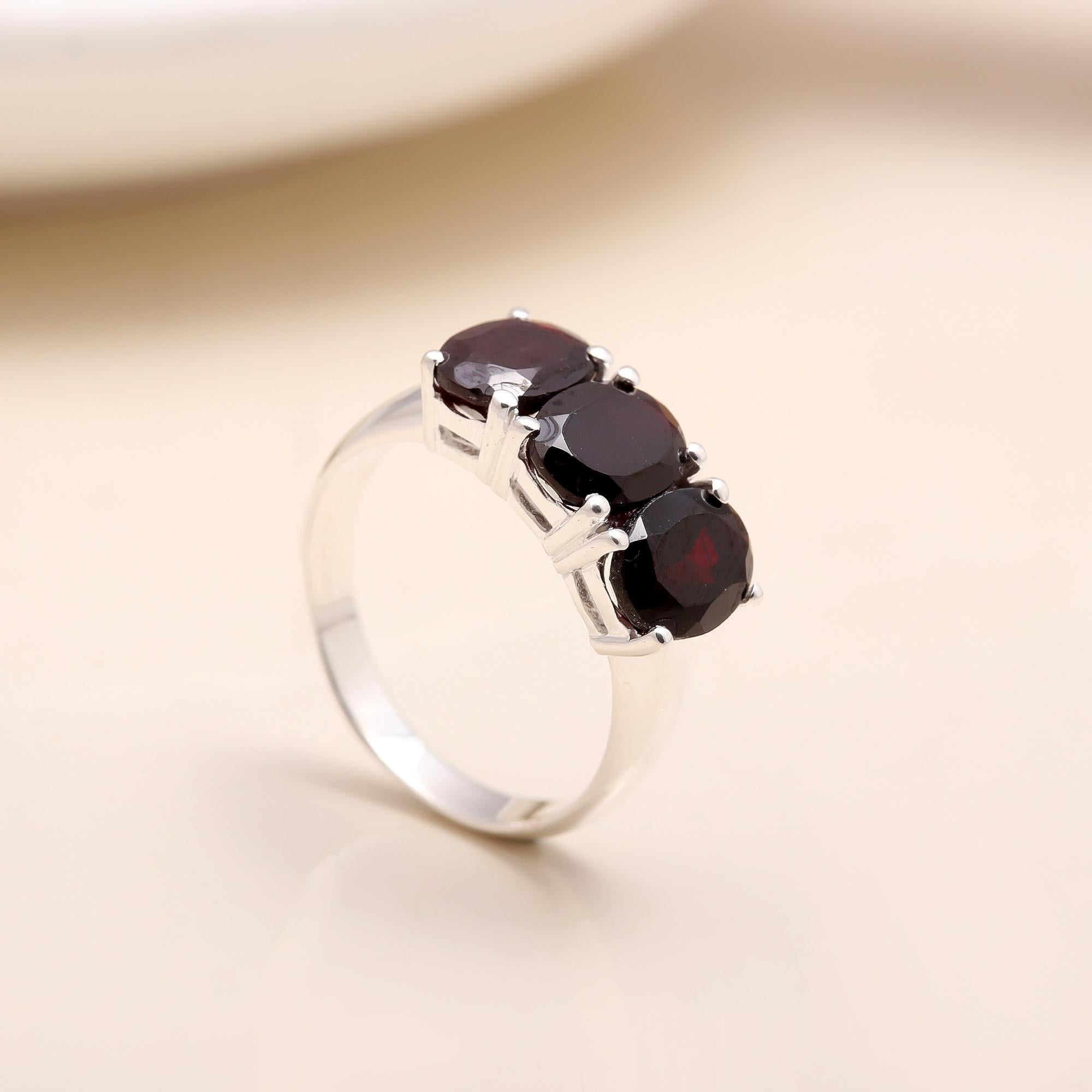 The Crimson Three: Oval Garnet Trio Ring